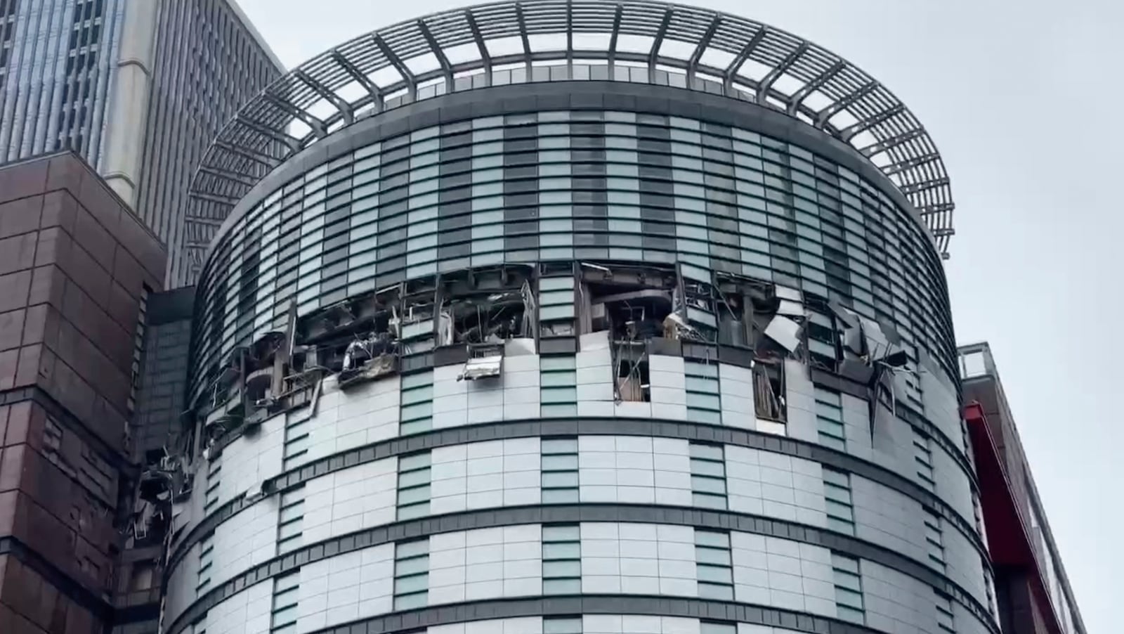 This image taken from video by Taiwan's TVBS shows the damaged facade of the Shin Kong Mitsukoshi department store after an explosion in Taichung city in Taiwan on Monday, Feb 13, 2025. (TVBS via AP )