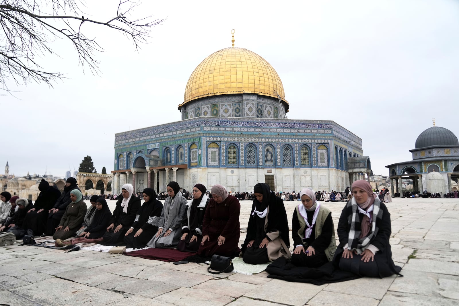 Worshippers beside the Dome of the Rock Mosque at the Al-Aqsa Mosque compound take part in the first Friday Prayers of the Muslim holy month of Ramadan in the Old City of Jerusalem, Friday, March 7, 2025. (AP Photo/Mahmoud Illean)