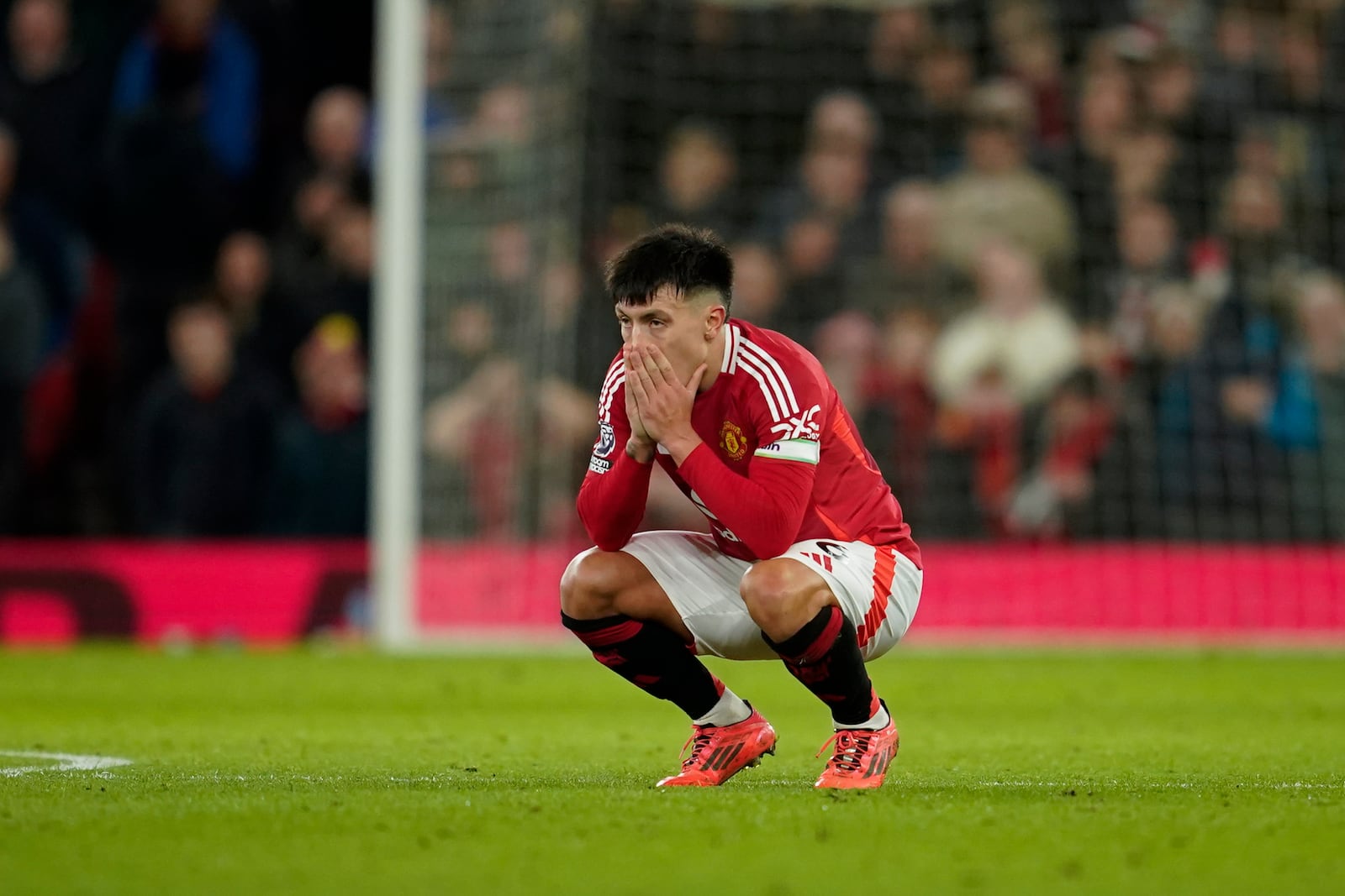 Manchester United's Lisandro Martinez reacts after missing a chance to score during the English Premier League soccer match between Manchester United and Newcastle at the Old Trafford stadium in Manchester, England, Monday, Dec. 30, 2024. (AP Photo/Dave Thompson)