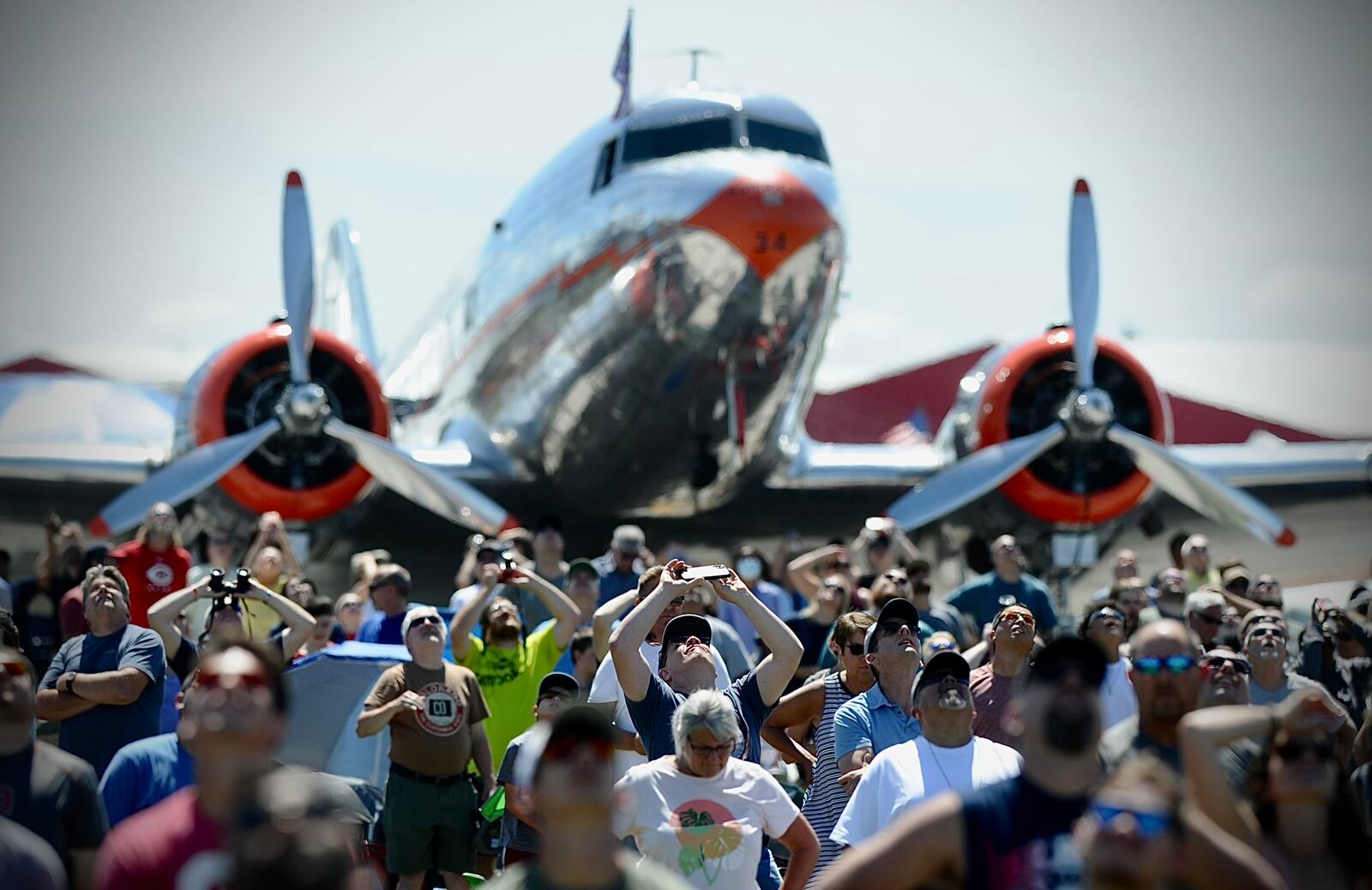 Spectators look to the skies at the Dayton Air Show on Saturday, July 30, 2022.