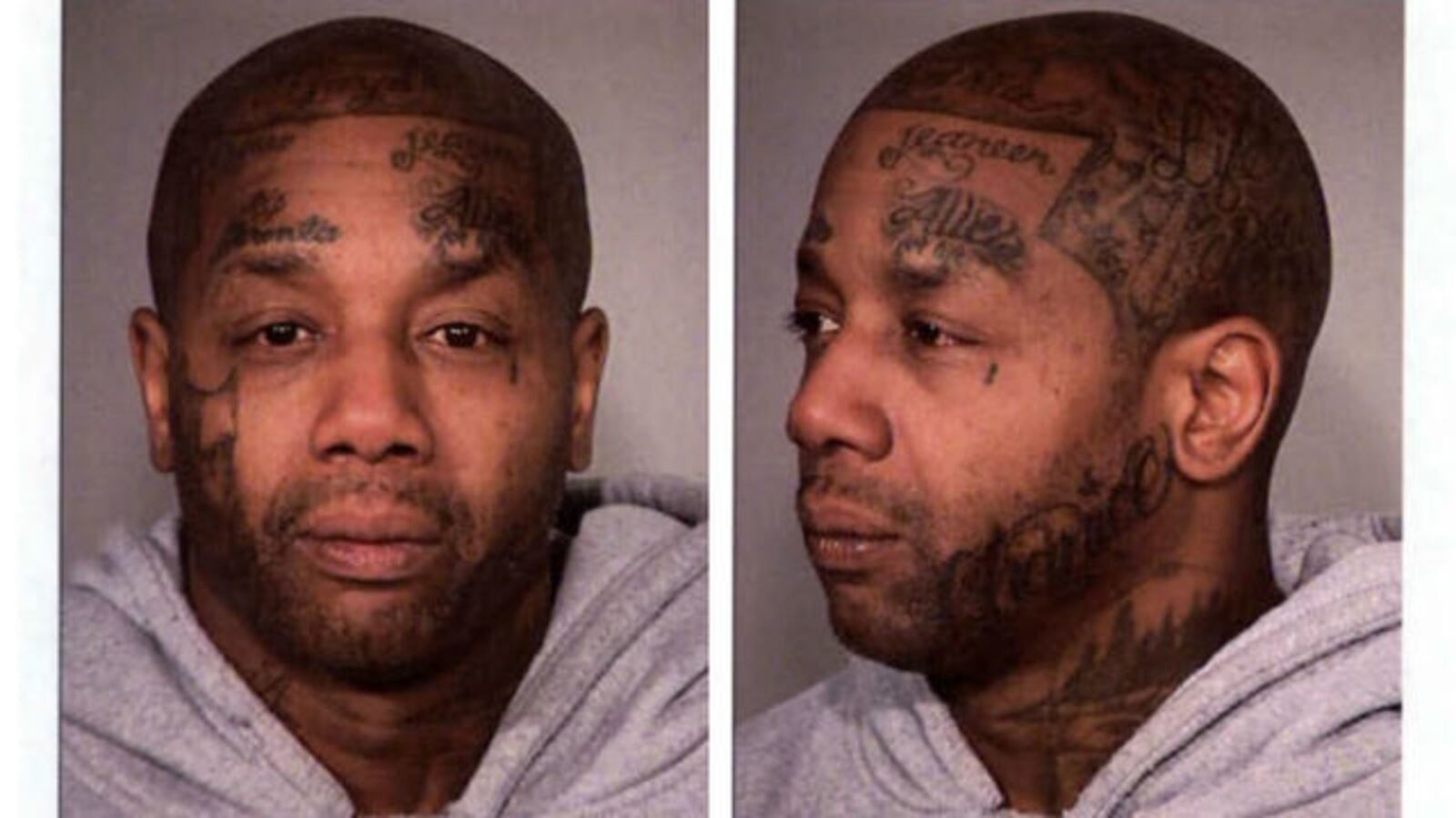 Tyrone Lamont Allen is seen during an April 2017, jail booking on outstanding warrants in Portland, Ore. Allen, 50, is accused of several robberies that month but his lawyer says Allen, who has facial tattoos not seen on the robber, is innocent.