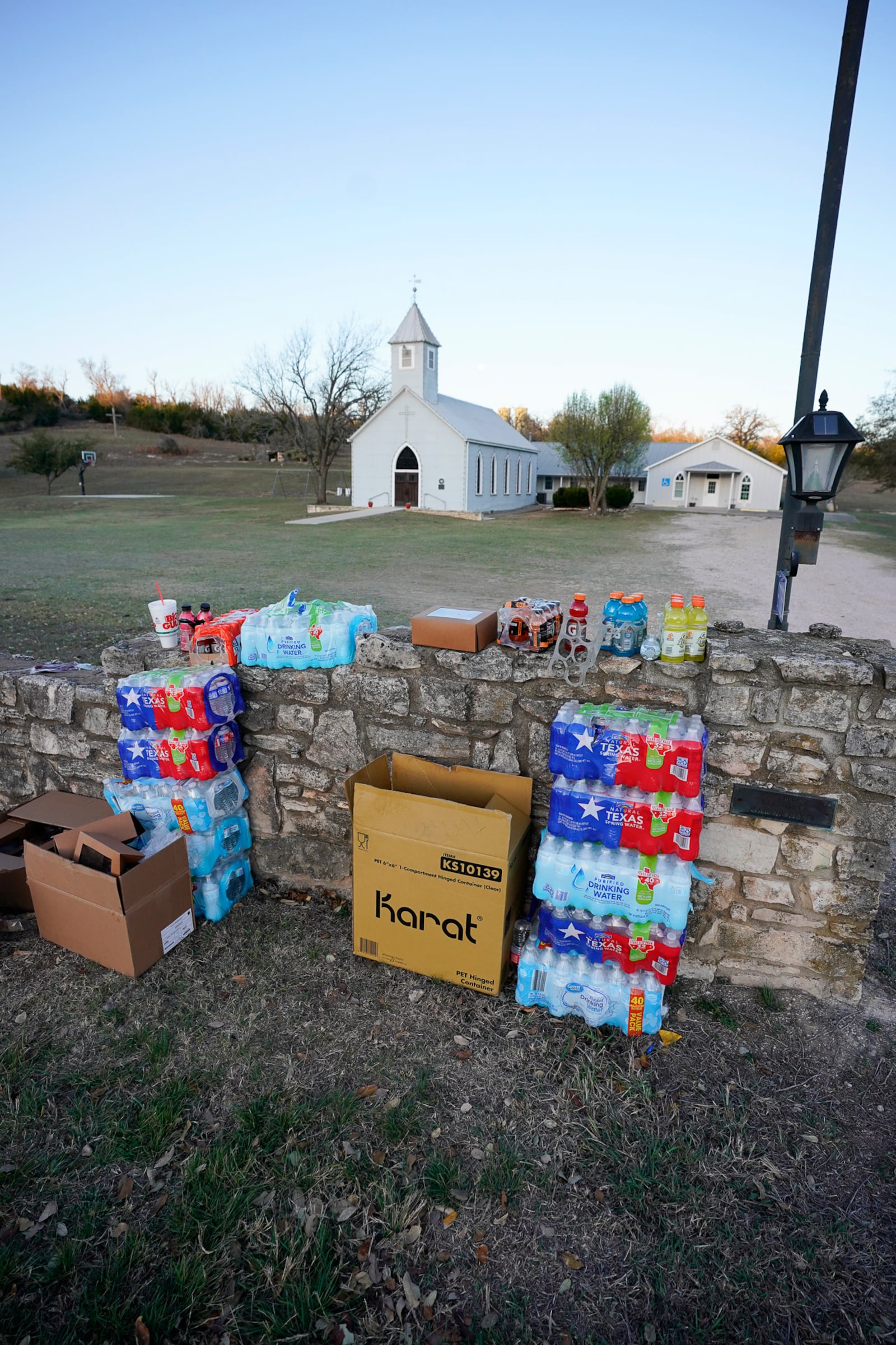 Supplies are set up in front of Gillespie County's St. Paul's Lutheran Cave Creek Church for first responders of the Crabapple Fire, Sunday, March 16, 2025, in Fredericksburg, Texas. (Robin Jerstad/The San Antonio Express-News via AP)