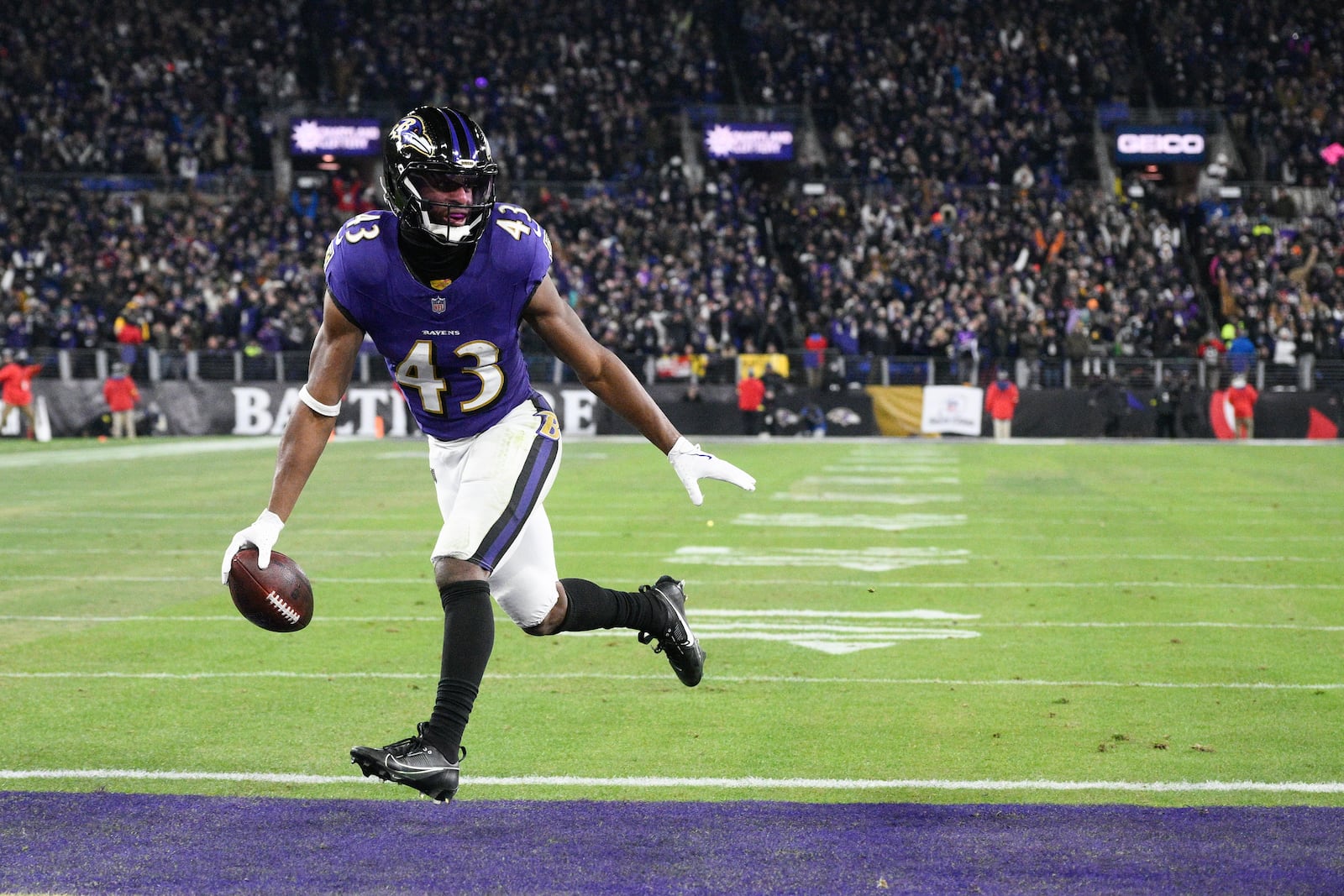 Baltimore Ravens running back Justice Hill scores on a pass from quarterback Lamar Jackson during the first half of an NFL wild-card playoff football game against the Pittsburgh Steelers, Saturday, Jan. 11, 2025, in Baltimore. (AP Photo/Nick Wass)