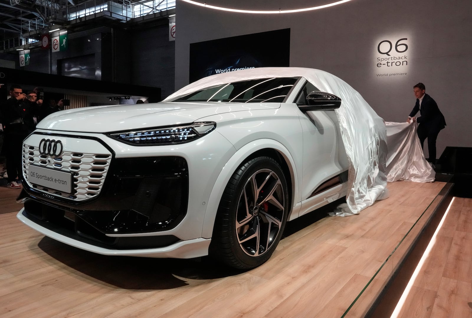 Audi unveils the world premiere Q6 Sportback e-tron car at the Paris Auto Show, in Paris, Monday, Oct. 14, 2024. (AP Photo/Michel Euler)