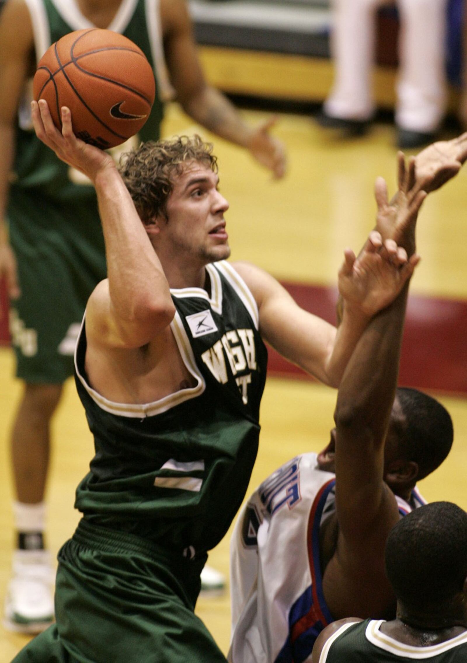 **SPCL FOR OHDAY** Wright State’s Drew Burleson shoots over Detroit Mercy’s Ryvon Covile in the second half Thursday, Feb. 10, 2005, in Detroit. (AP Photo/John F. Martin