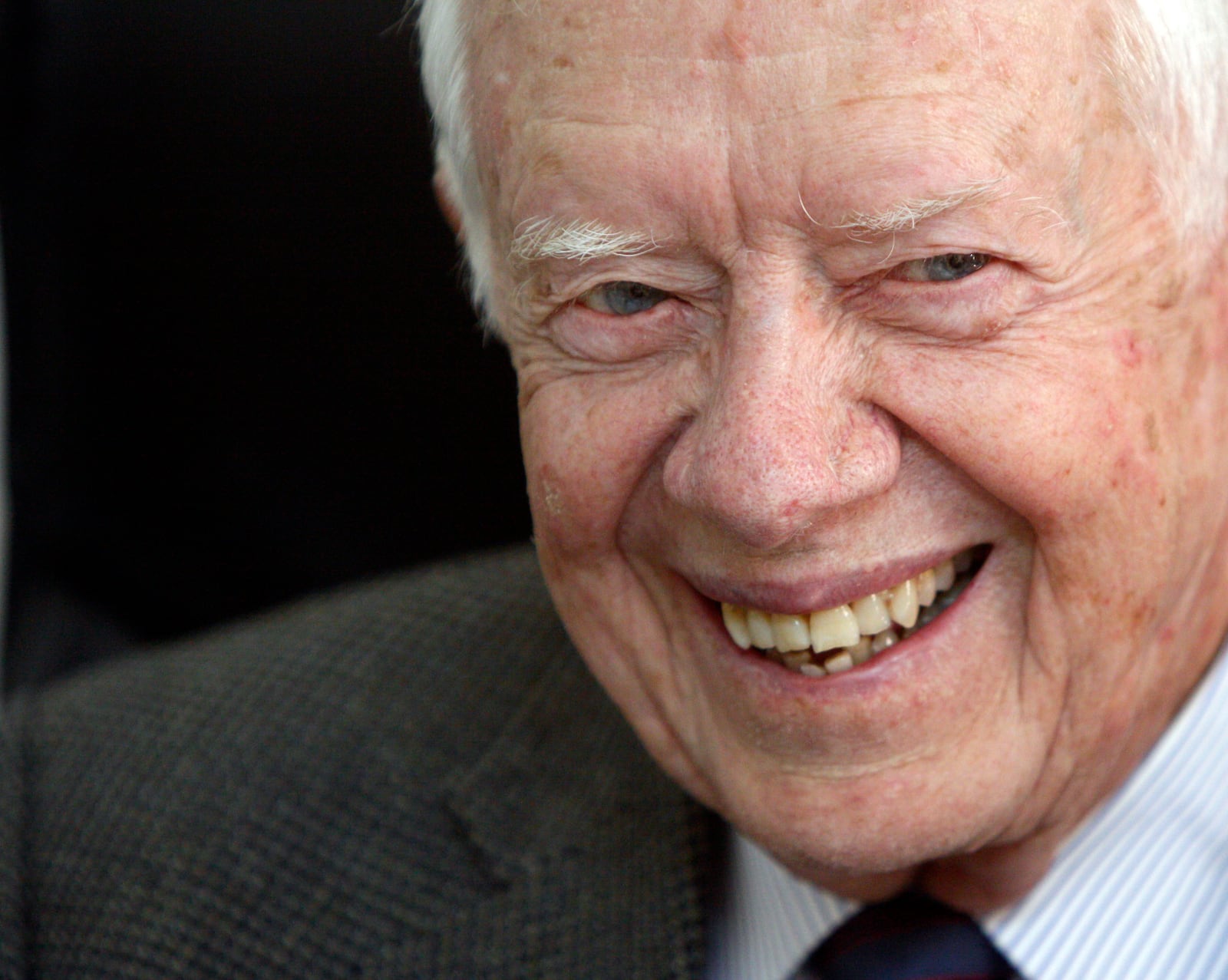 FILE - Former U.S. President Jimmy Carter smiles during a meeting with Sudanese officials at the national elections commission in Khartoum, Sudan, April 9, 2010. Carter was in the country to help monitor the elections. (AP Photo/Amr Nabil, File)