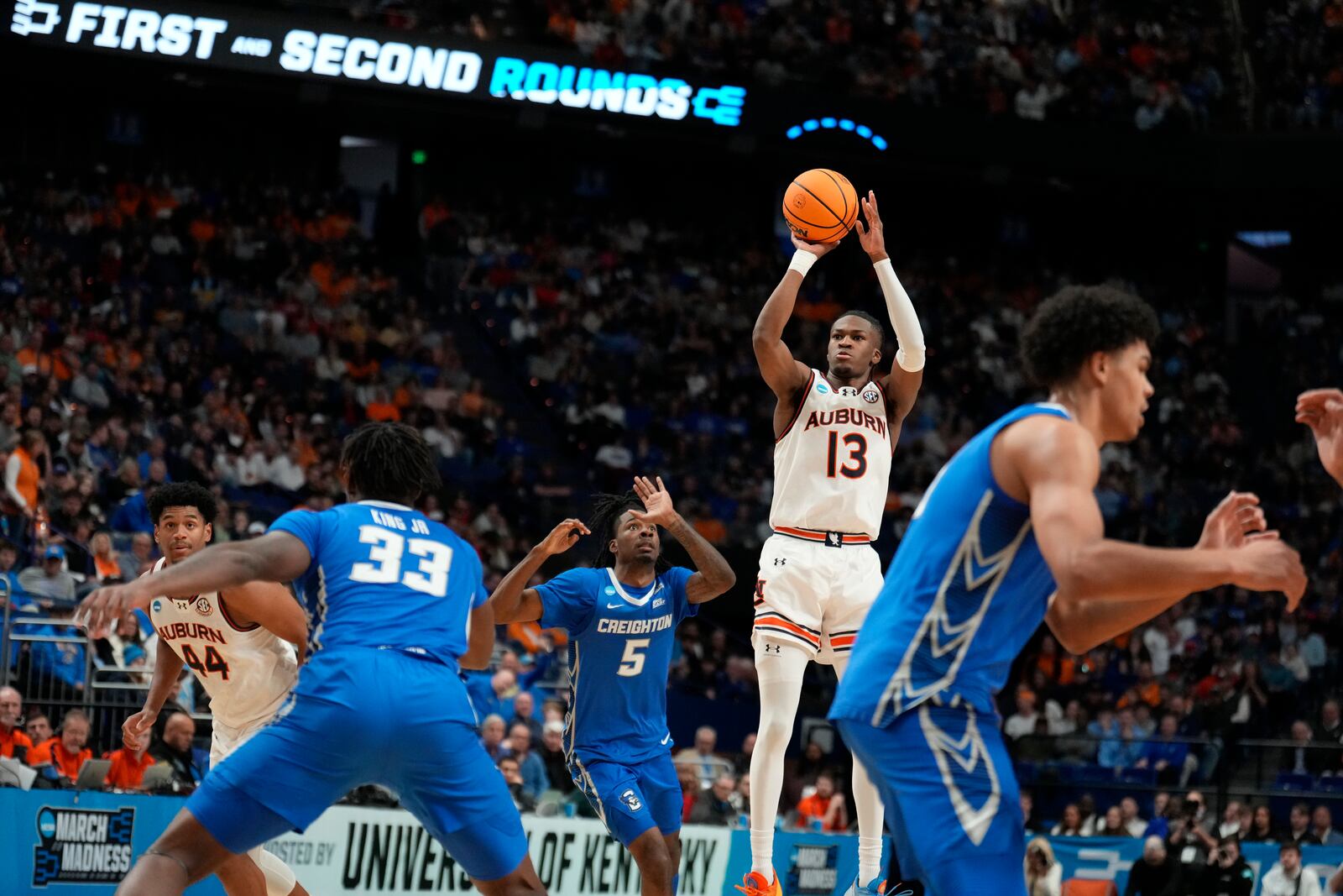 Auburn guard Miles Kelly (13) shoots during the first half in the second round of the NCAA college basketball tournament against Creighton, Saturday, March 22, 2025, in Lexington, Ky. (AP Photo/Brynn Anderson)