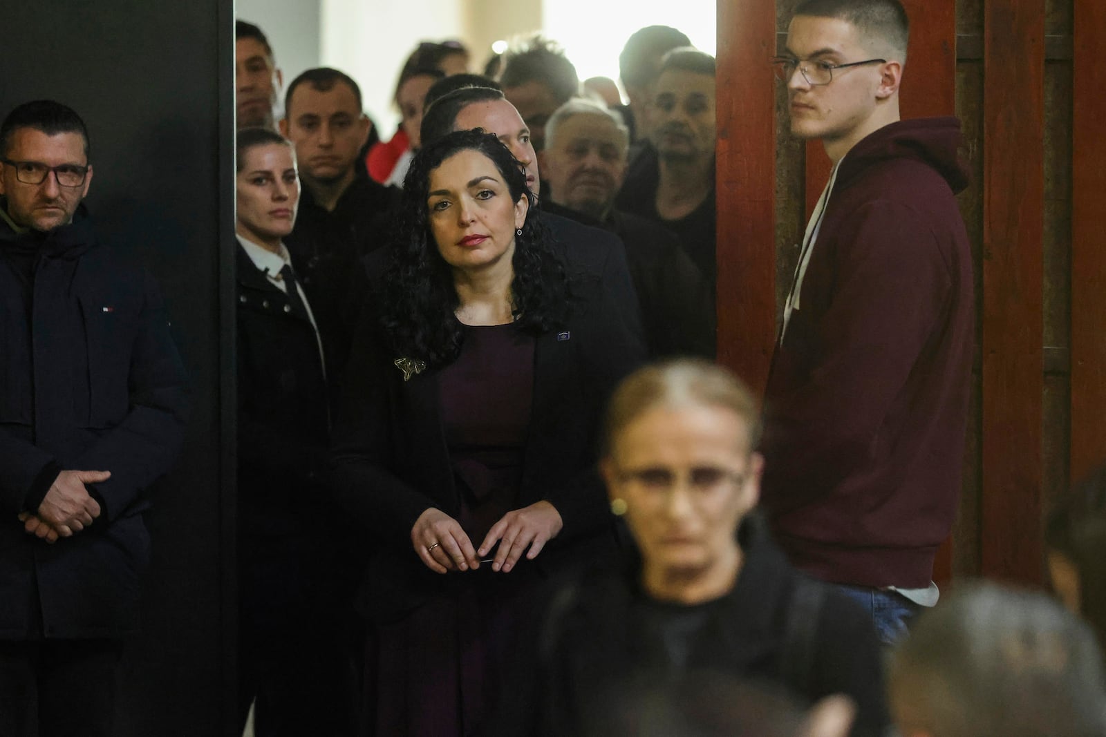 Kosovo's President Vjosa Osmani waits in line before casting her ballot during parliamentary election in Pristina, Kosovo, Sunday, Feb. 9, 2025. (AP Photo/Vlasov Sulaj)