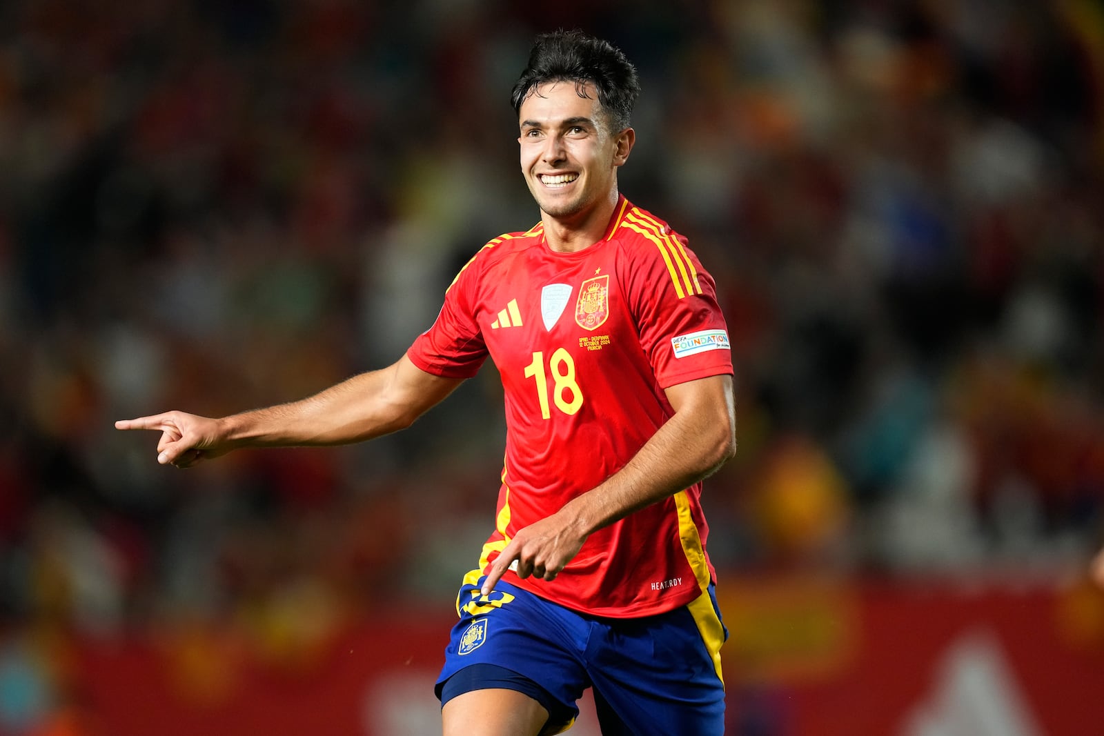 Spain's Martín Zubimendi celebrates after scoring the opening goal during the UEFA Nations League group 4 soccer match between Spain and Denmark in Murcia, Spain, Saturday, Oct. 12, 2024. (AP Photo/Jose Breton)