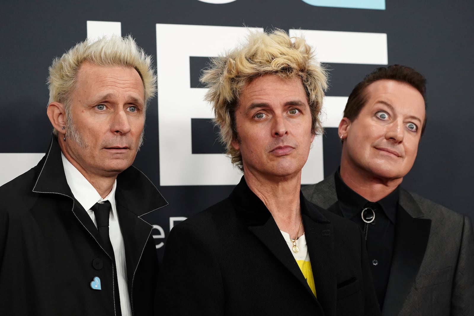 Mike Dirnt, from left, Billie Joe Armstrong, and Tre Cool of 'Green Day' arrive at the 67th annual Grammy Awards on Sunday, Feb. 2, 2025, in Los Angeles. (Photo by Jordan Strauss/Invision/AP)