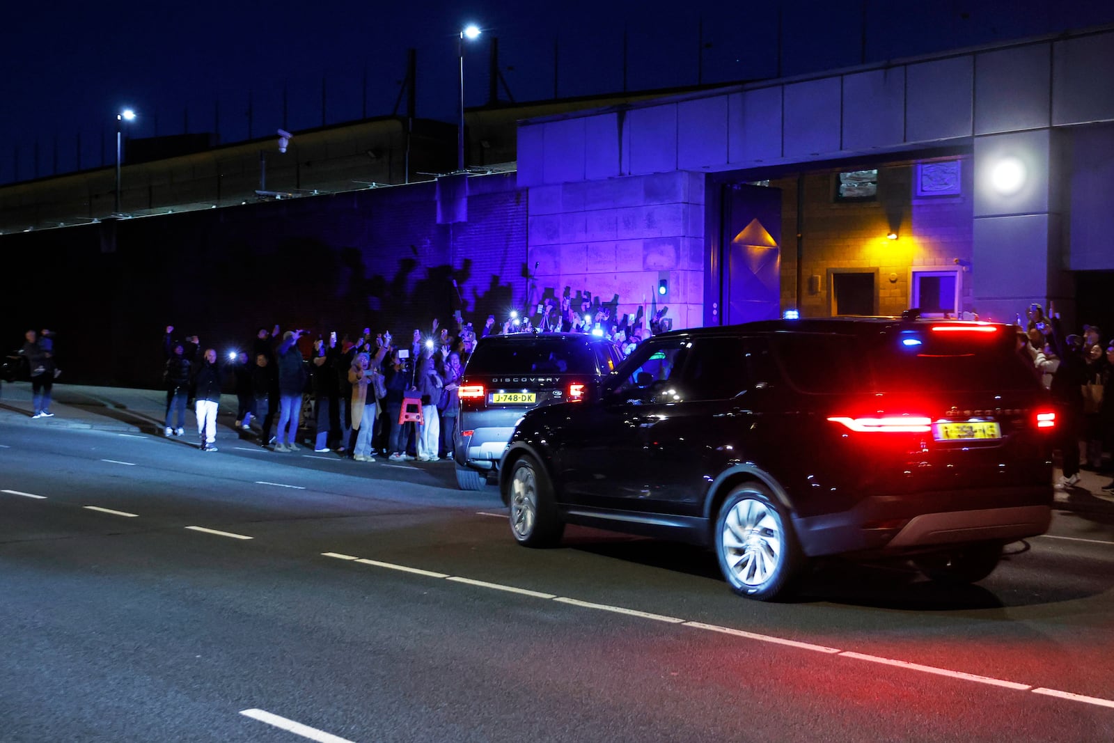 A motorcade believed to be carrying former Philippine President Rodrigo Duterte arrives at the International Criminal Court detention center near The Hague in Scheveningen, Netherlands, Wednesday, March 12, 2025. (AP Photo/Omar Havana)