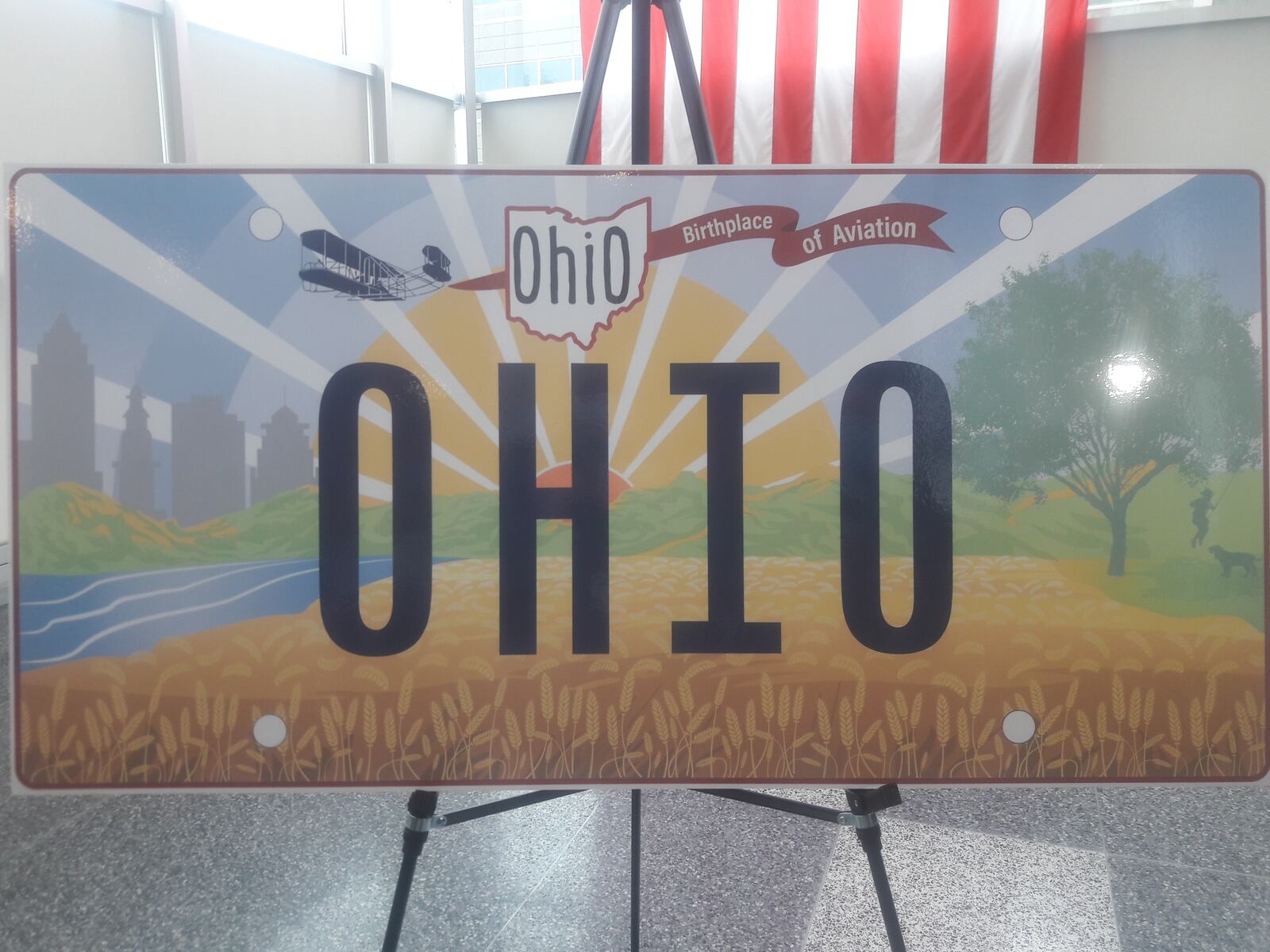 An oversize mock-up of the new "Sunrise in Ohio" license plate on display Oct. 21, 2021. The new standard plate will be available Dec. 29.