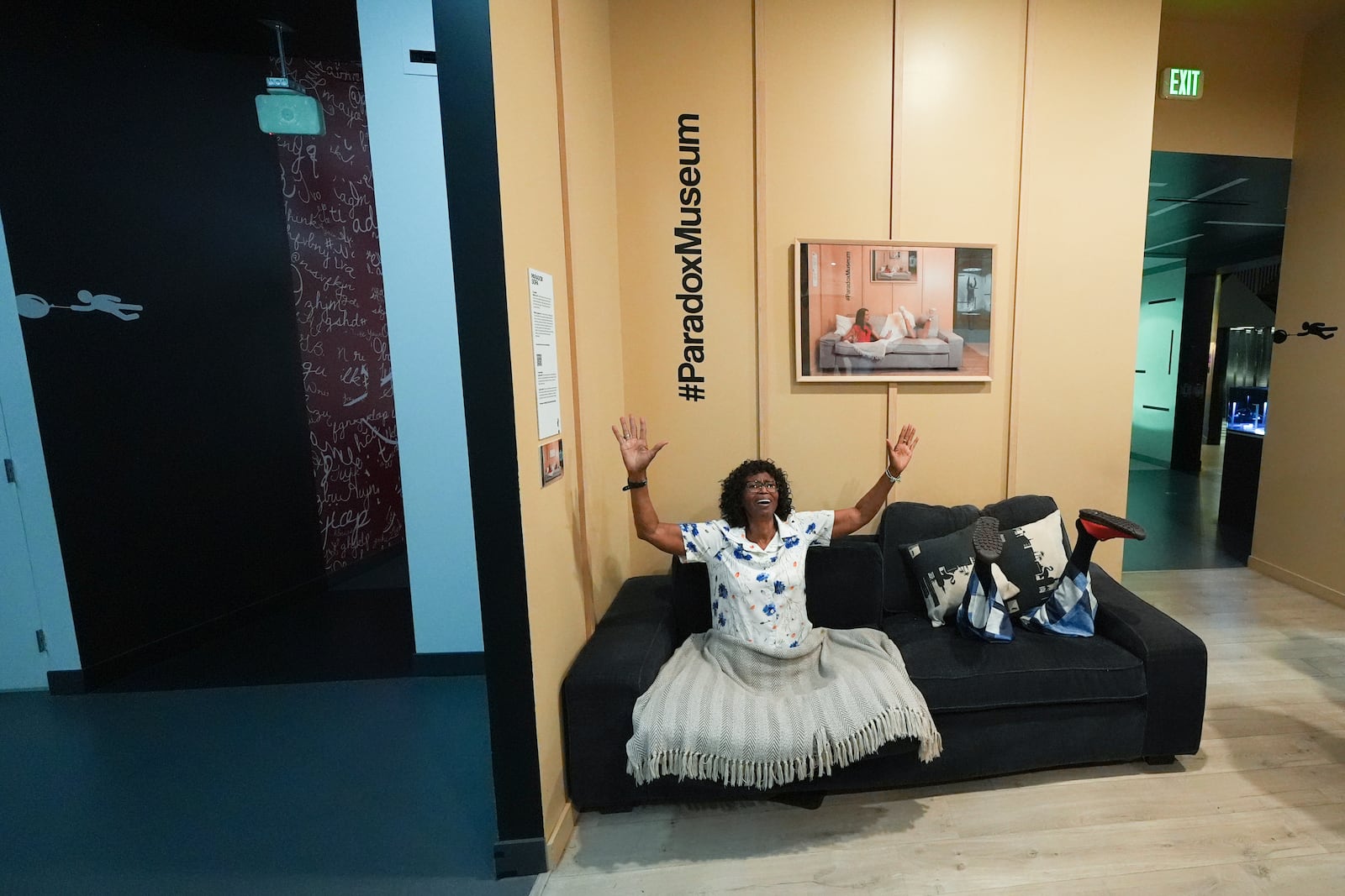 Members of the Miller family, visiting from Memphis, Tenn., pose in an installation at Paradox Museum Miami, Tuesday, Jan. 28, 2025, in Miami. (AP Photo/Rebecca Blackwell)