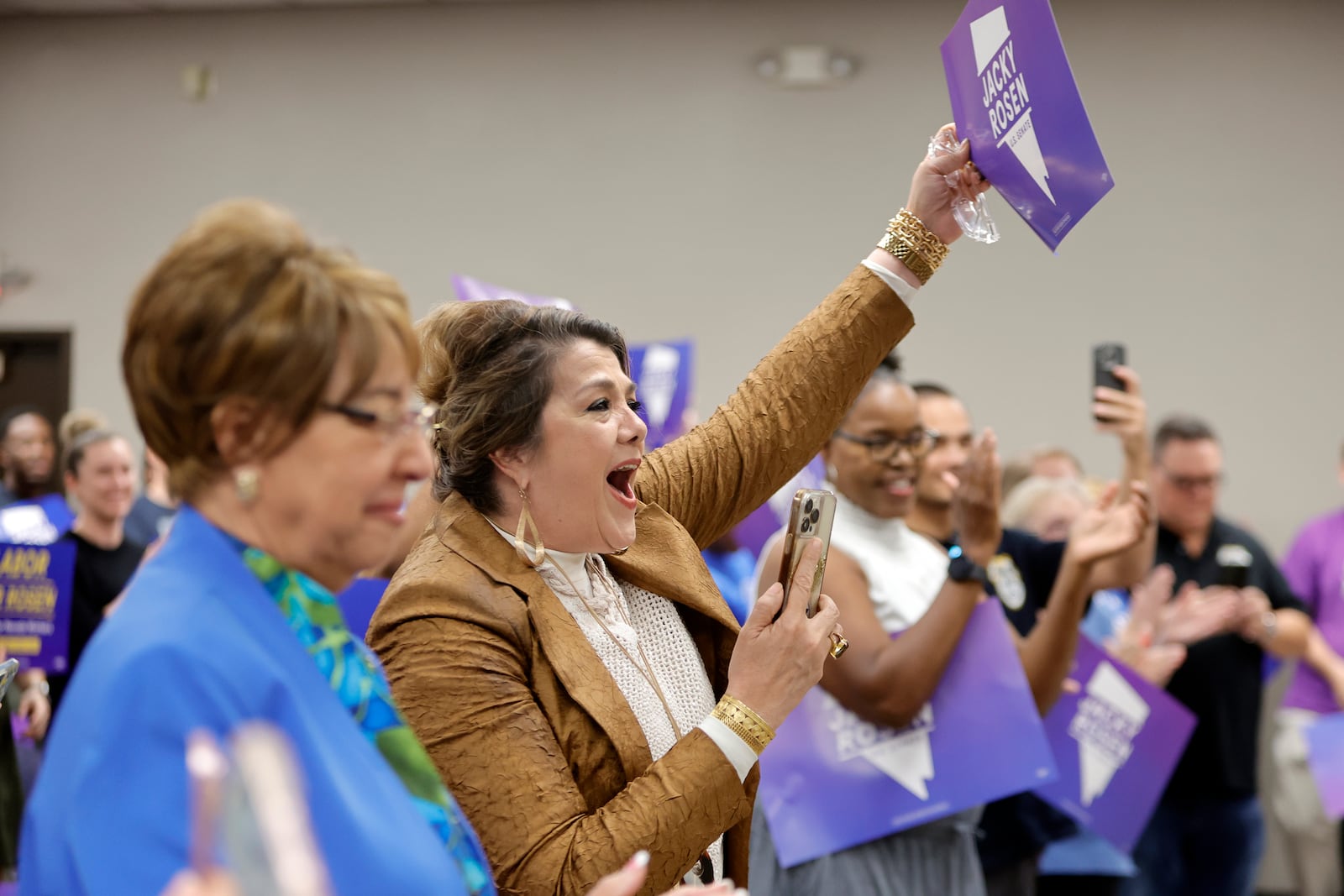 Maritza Rodriguez, center, cheers as Sen. Jacky Rosen, D-Nev., arrives to give a victory speech at the Teamsters Local 631 meeting hall Saturday, Nov. 9, 2024, in Las Vegas. (Steve Marcus/Las Vegas Sun via AP)