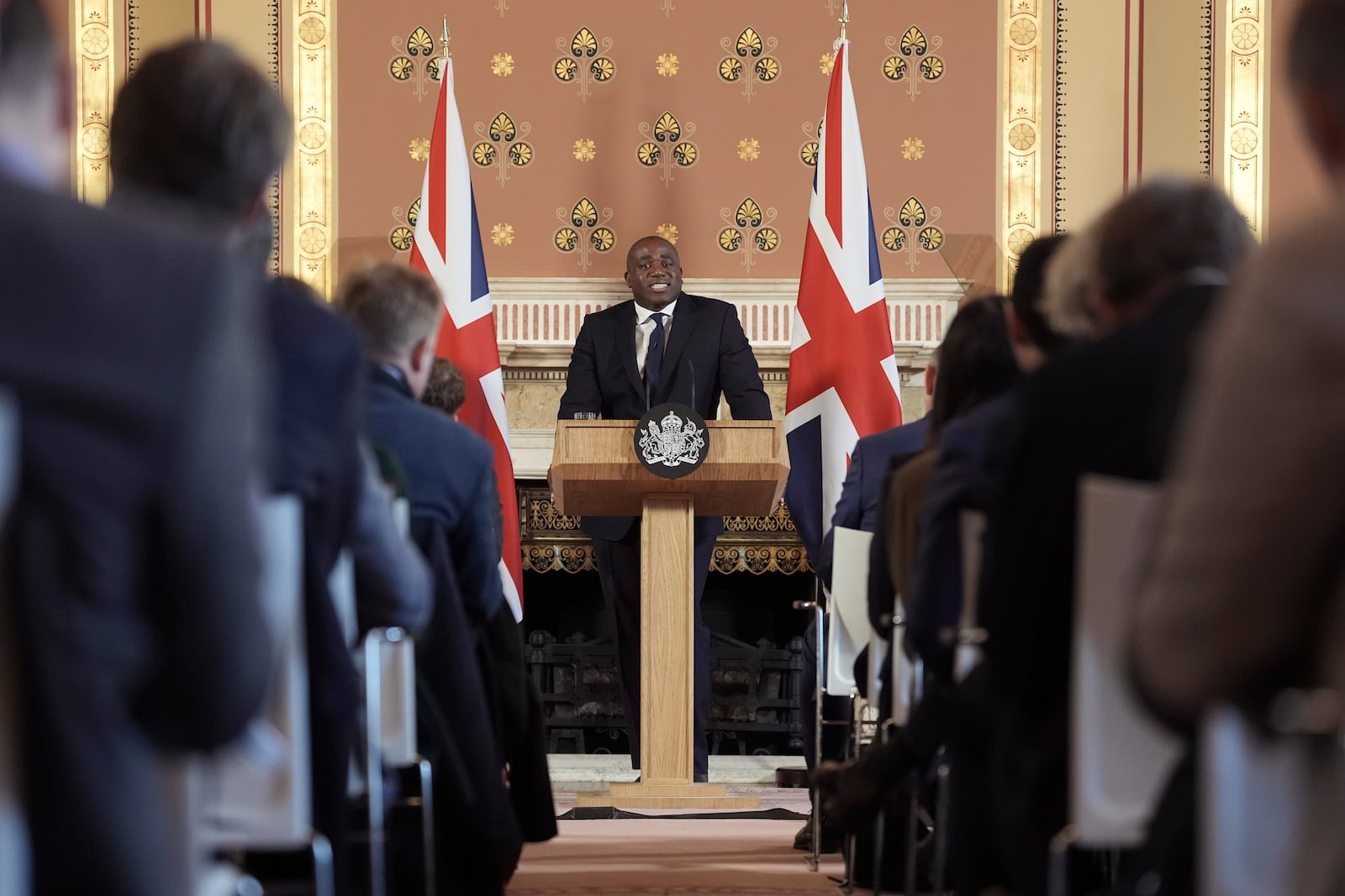 Britain's Foreign Secretary David Lammy delivers a speech on the government plans for new sanctions which will target the finances of people smuggling networks as part of efforts to stop migrants crossing the English Channel, in London, Thursday, Jan. 9, 2025. (Stefan Rousseau/Pool Photo via AP)