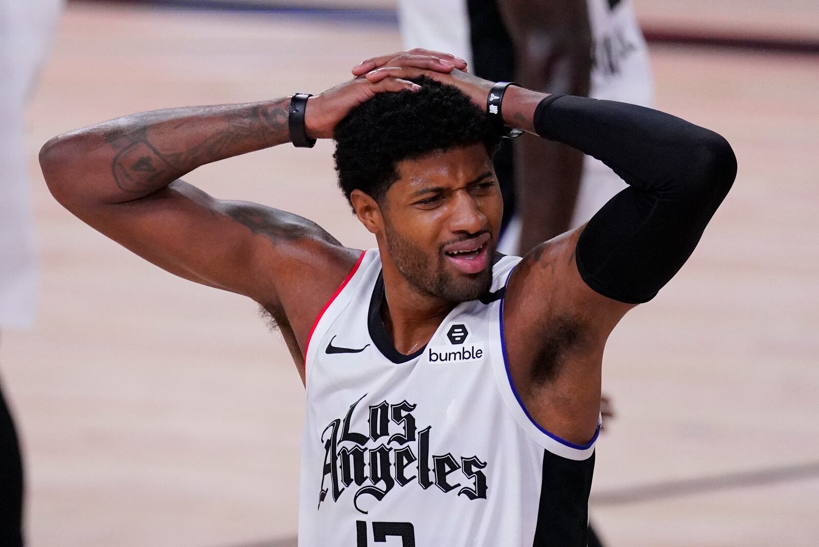 Los Angeles Clippers' Paul George (13) reacts after being called for a foul during the first half of an NBA conference semifinal playoff basketball game against the Denver Nuggets, Wednesday, Sept. 9, 2020, in Lake Buena Vista, Fla. (AP Photo/Mark J. Terrill)