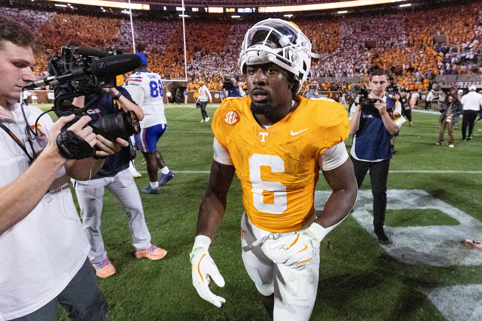 Tennessee running back Dylan Sampson (6) leaves the field after scoring the game-winning touchdown in overtime of an NCAA college football game against Florida, Saturday, Oct. 12, 2024, in Knoxville, Tenn. (AP Photo/Wade Payne)