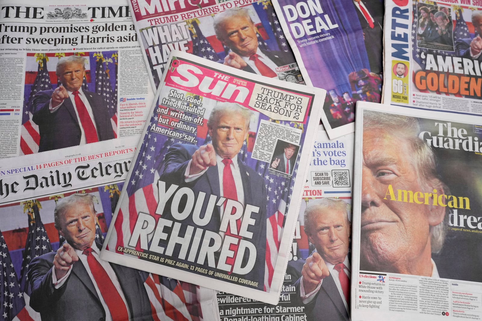 FILE - Britain's newspapers' front pages reporting on President-elect Donald Trump in the U.S. presidential election are seen in London, Nov. 7, 2024. (AP Photo/Kirsty Wigglesworth, File)