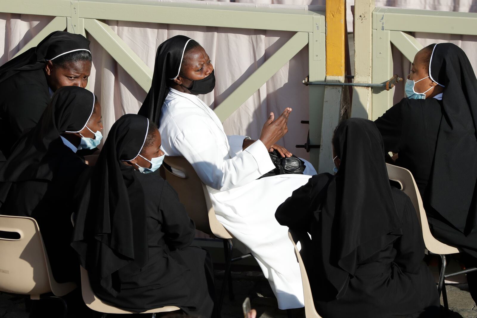 Nuns chat as they wait for Pope Francis weekly general audience in San Damaso courtyard at the Vatican, Wednesday, Sept. 9, 2020. (AP Photo/Andrew Medichini)