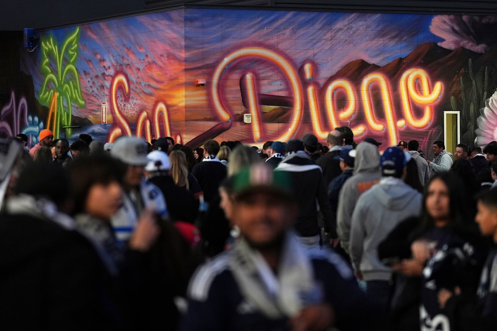 Fans arrive before San Diego FC hosts St. Louis City in an MLS soccer match Saturday, March 1, 2025, in San Diego. (AP Photo/Gregory Bull)