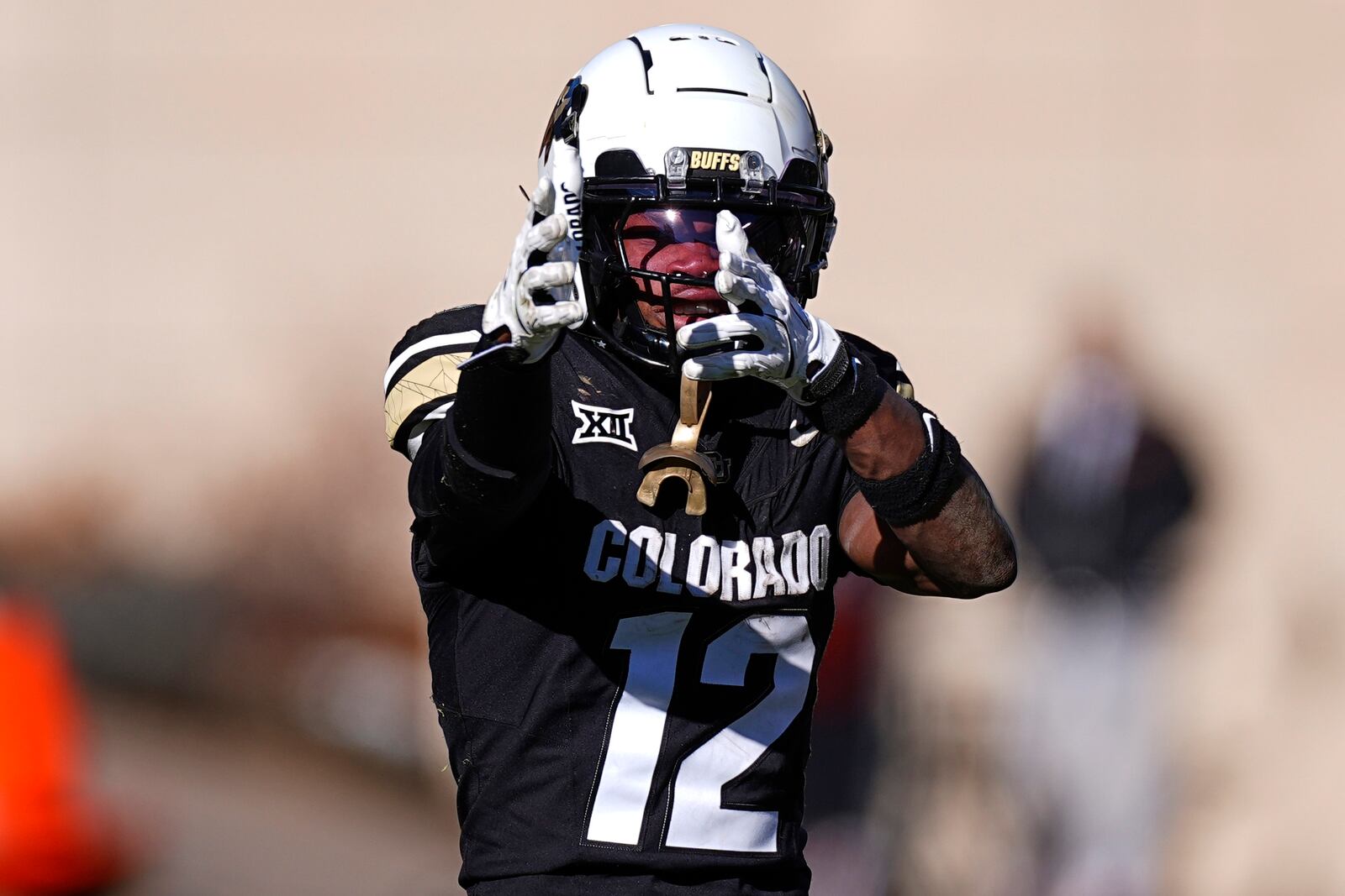 FILE - Colorado wide receiver Travis Hunter (12) reacts in the second half of an NCAA college football game Friday, Nov. 29, 2024, in Boulder, Colo. (AP Photo/David Zalubowski, File)