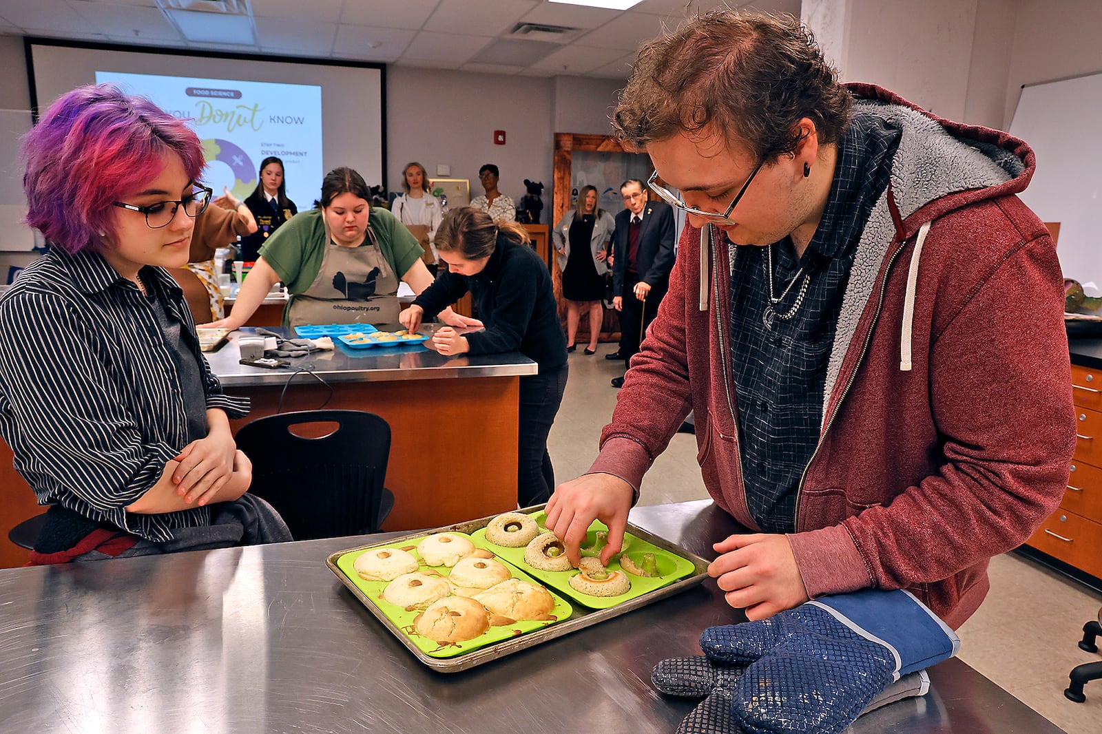 Global Impact STEM Academy students work on a food project project in their Food Science class Tuesday, March 28, 2023. BILL LACKEY/STAFF