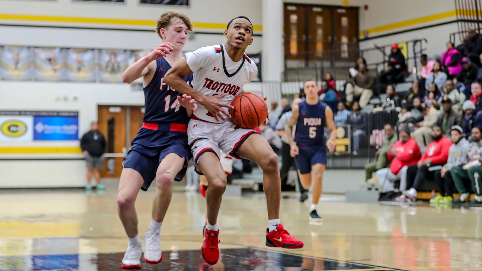 The Trotwood Madison High School boys basketball team beat Piqua 79-22 in a Division I district semifinal game on Tuesday, Feb. 26, at Centerville High School. MICHAEL COOPER/STAFF PHOTO