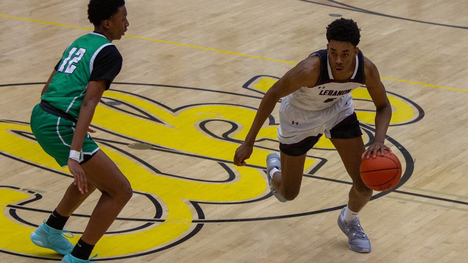 Lebanon's Anthony Thompson drives against Northmont's Chisom Ibe during the second half of the Warriors' tournament win at Centerville High School last season. Jeff Gilbert/CONTRIBUTED