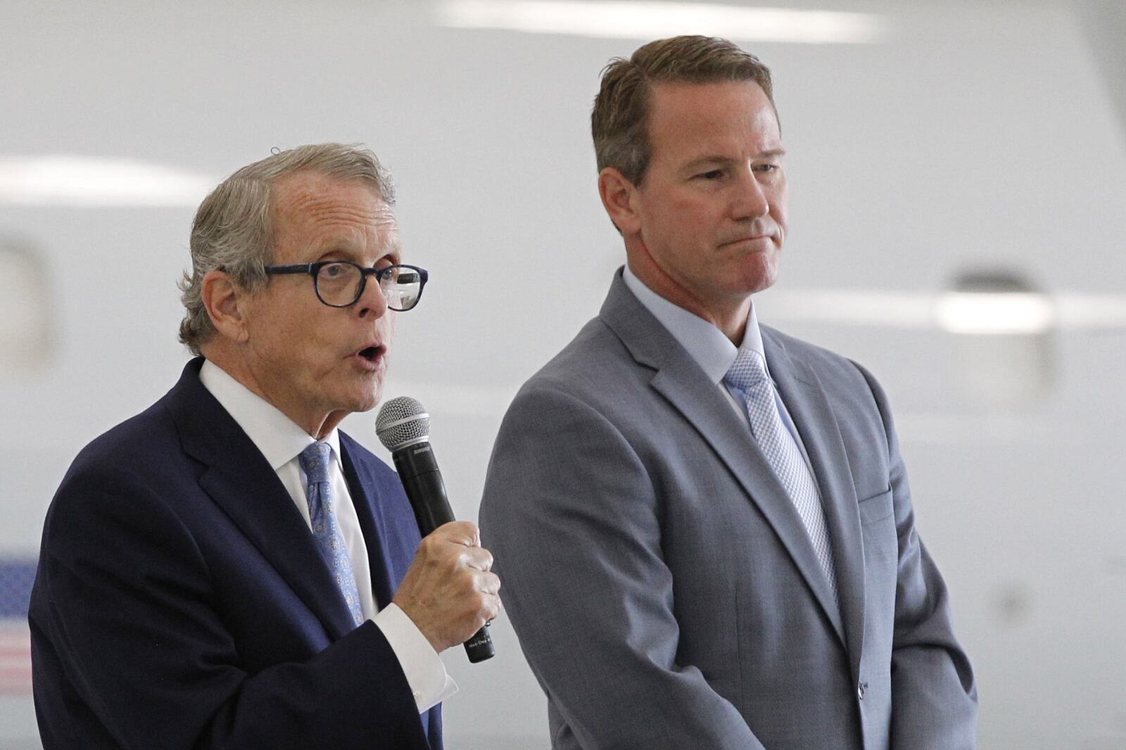 Candidate for Ohio Governor Mike DeWine, left, with running mate for Lt. Governor Jon Husted during a Dayton Chamber of Commerce meeting on Thursday, August 16. TY GREENLEES / STAFF