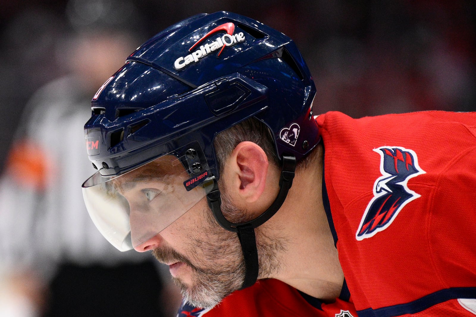 Washington Capitals left wing Alex Ovechkin (8) wears a special helmet decal in support of the figure skating community and all those affected by the Flight 5342 tragedy during the first period of an NHL hockey game against the Tampa Bay Lightning, Saturday, March 1, 2025, in Washington. (AP Photo/Nick Wass)