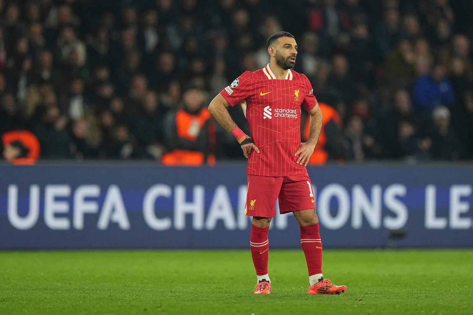 Liverpool's Mohamed Salah stands on the pitch during the Champions League round of 16 first leg soccer match between Paris Saint-Germain and Liverpool at the Parc des Princes in Paris, Wednesday, March 5, 2025. (AP Photo/Aurelien Morissard)