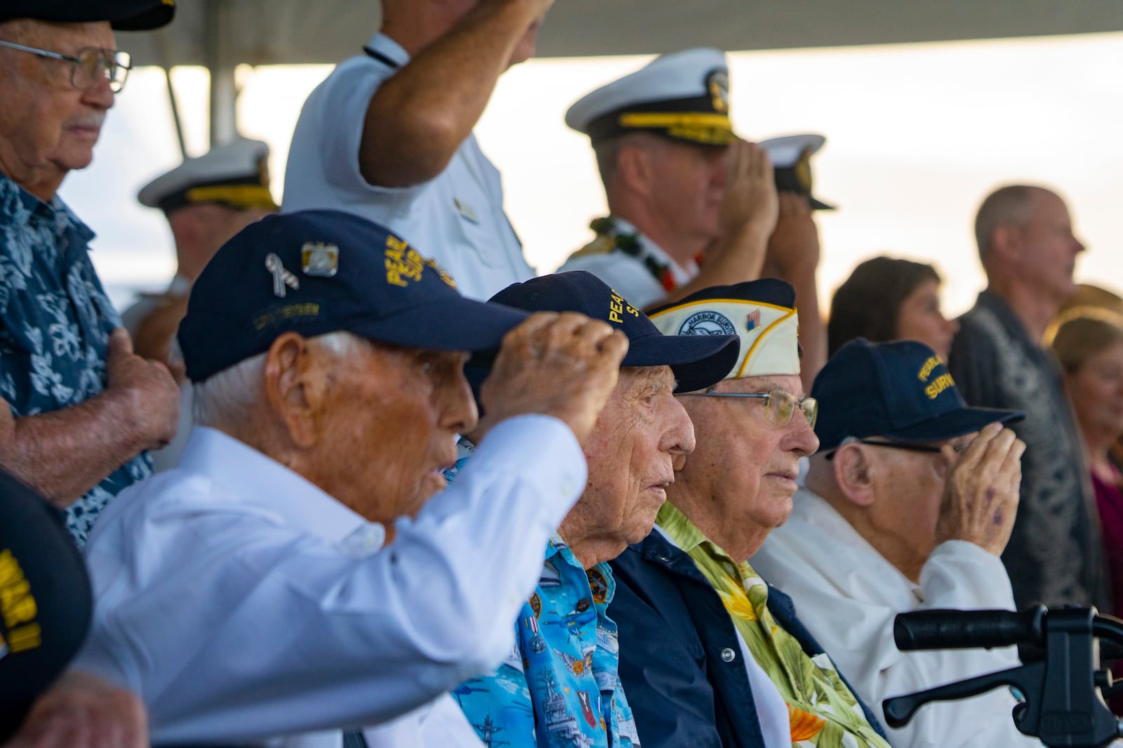 FILE - Pearl Harbor survivors Harry Chandler, from left, Ken Stevens, Herb Elfring and Ira "Ike" Schab salute while the national anthem is played during the 82nd Pearl Harbor Remembrance Day ceremony on Dec. 7, 2023, at Pearl Harbor in Honolulu. (AP Photo/Mengshin Lin, File)