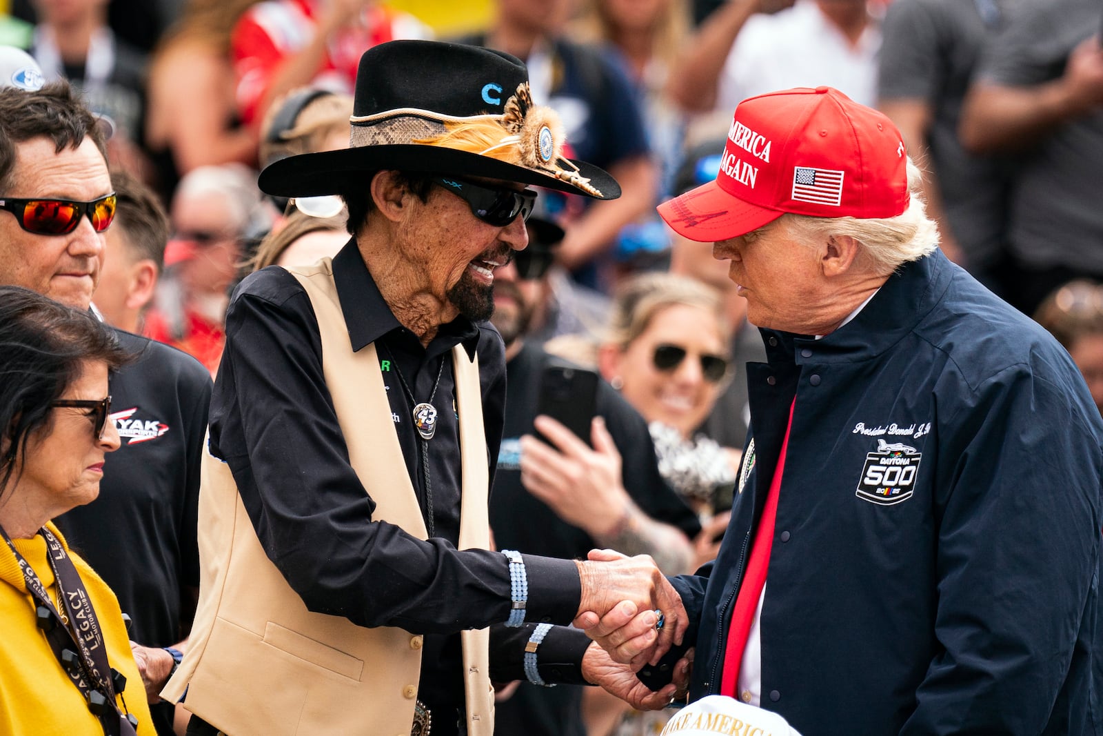 President Donald Trump greets Richard Petty at the NASCAR Daytona 500 auto race at Daytona International Speedway, Sunday, Feb. 16, 2025, in Daytona Beach, Fla. (Pool via AP)