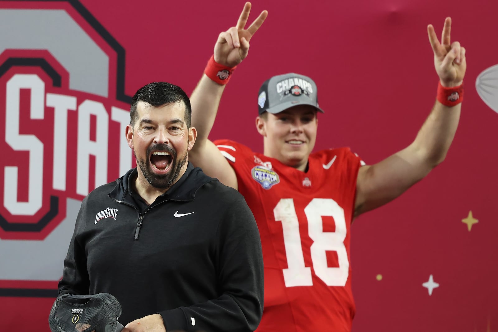 Ohio State head coach Ryan Day, left, and quarterback Will Howard (18) celebrate after the Cotton Bowl College Football Playoff semifinal game against Texas, Friday, Jan. 10, 2025, in Arlington, Texas. (AP Photo/Gareth Patterson)