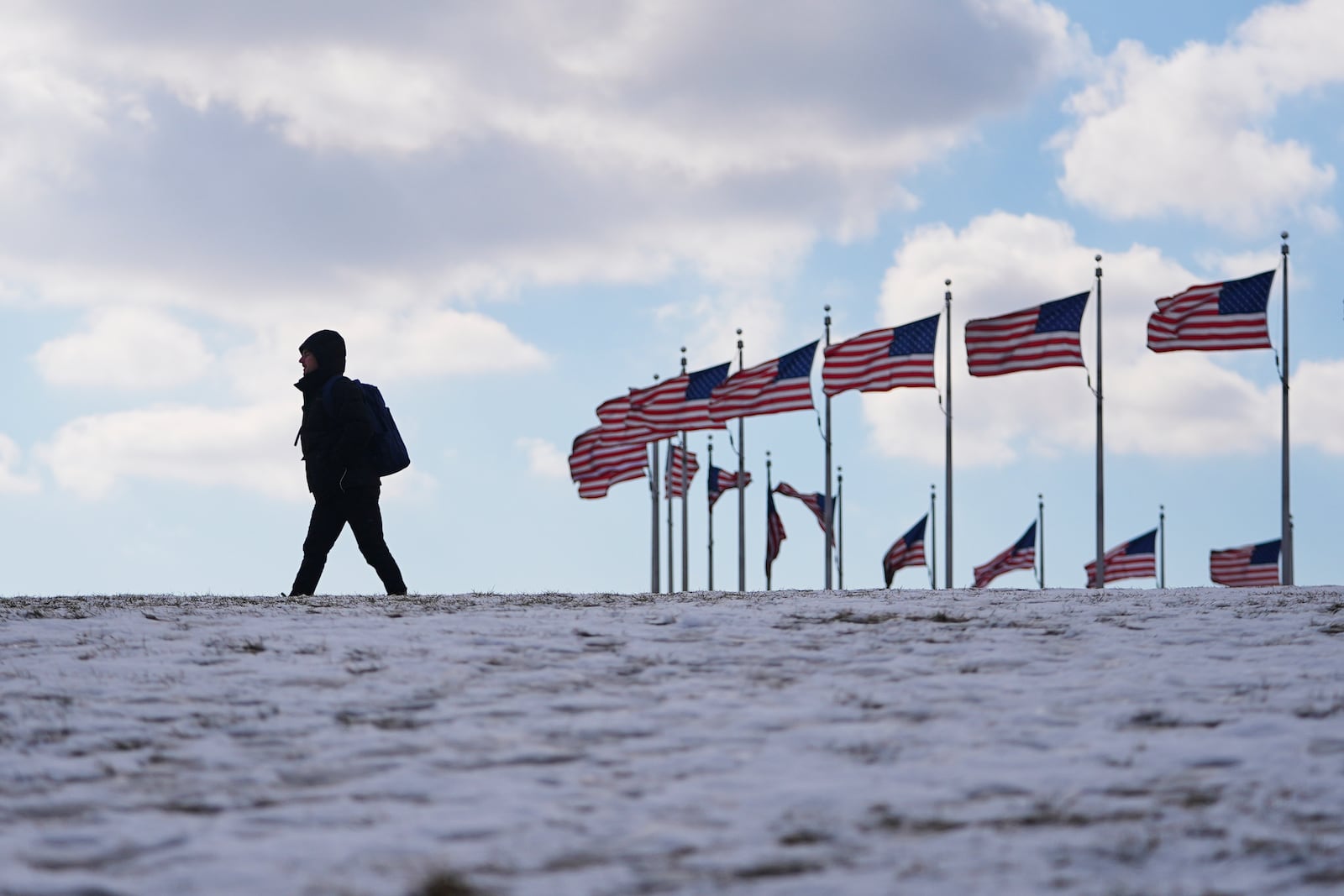 U.S. flags around the Washington Monument are at full staff ahead of the 60th Presidential Inauguration, Monday, Jan. 20, 2025, in Washington. Flags are supposed to fly at half-staff through the end of January out of respect for former President Jimmy Carter, who died Dec. 29, 2024. (AP Photo/Julio Cortez)