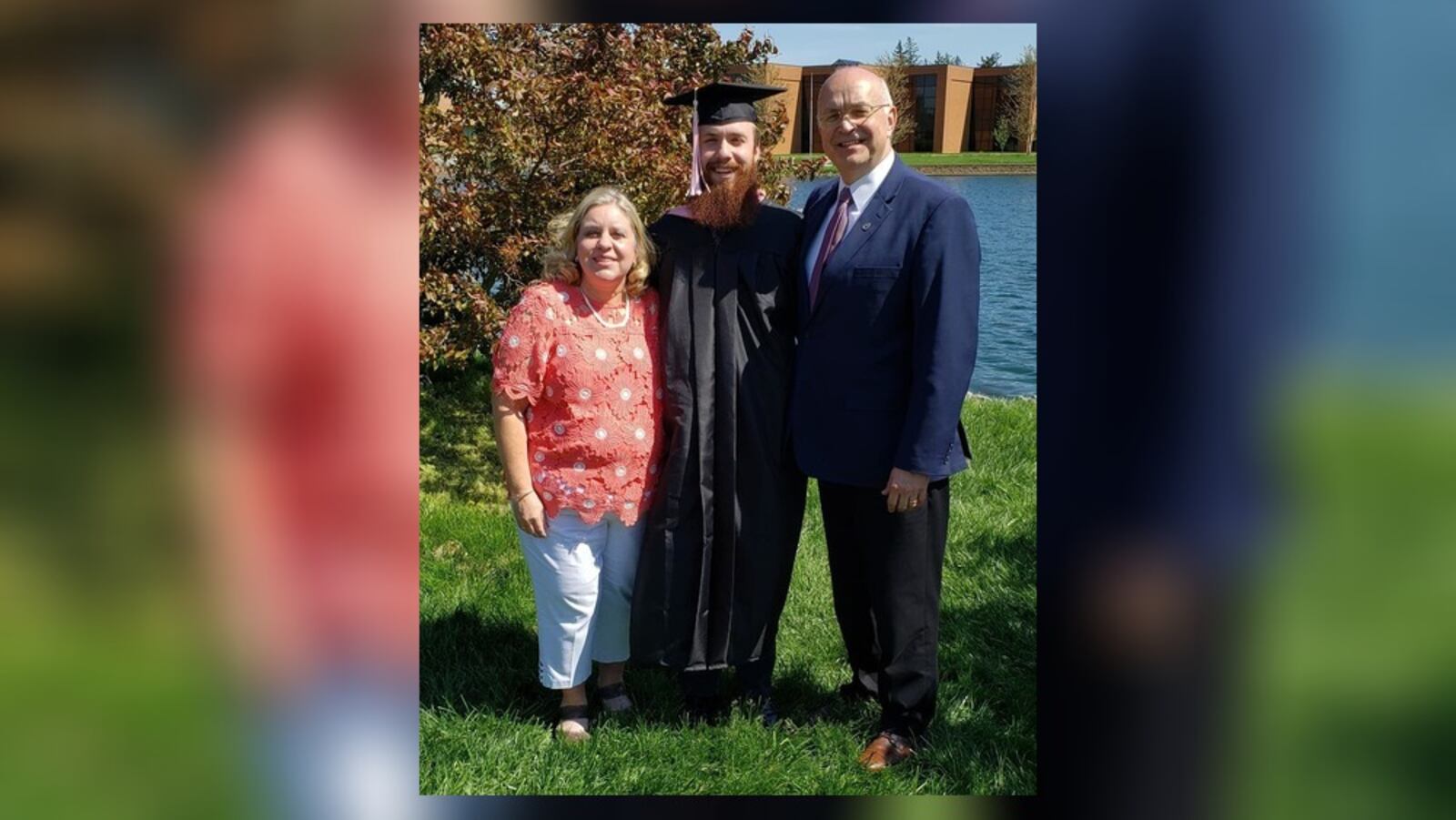 David Kravets, a Cedarville University graduate, stands with his mom and dad at Cedarville's commencement ceremony.