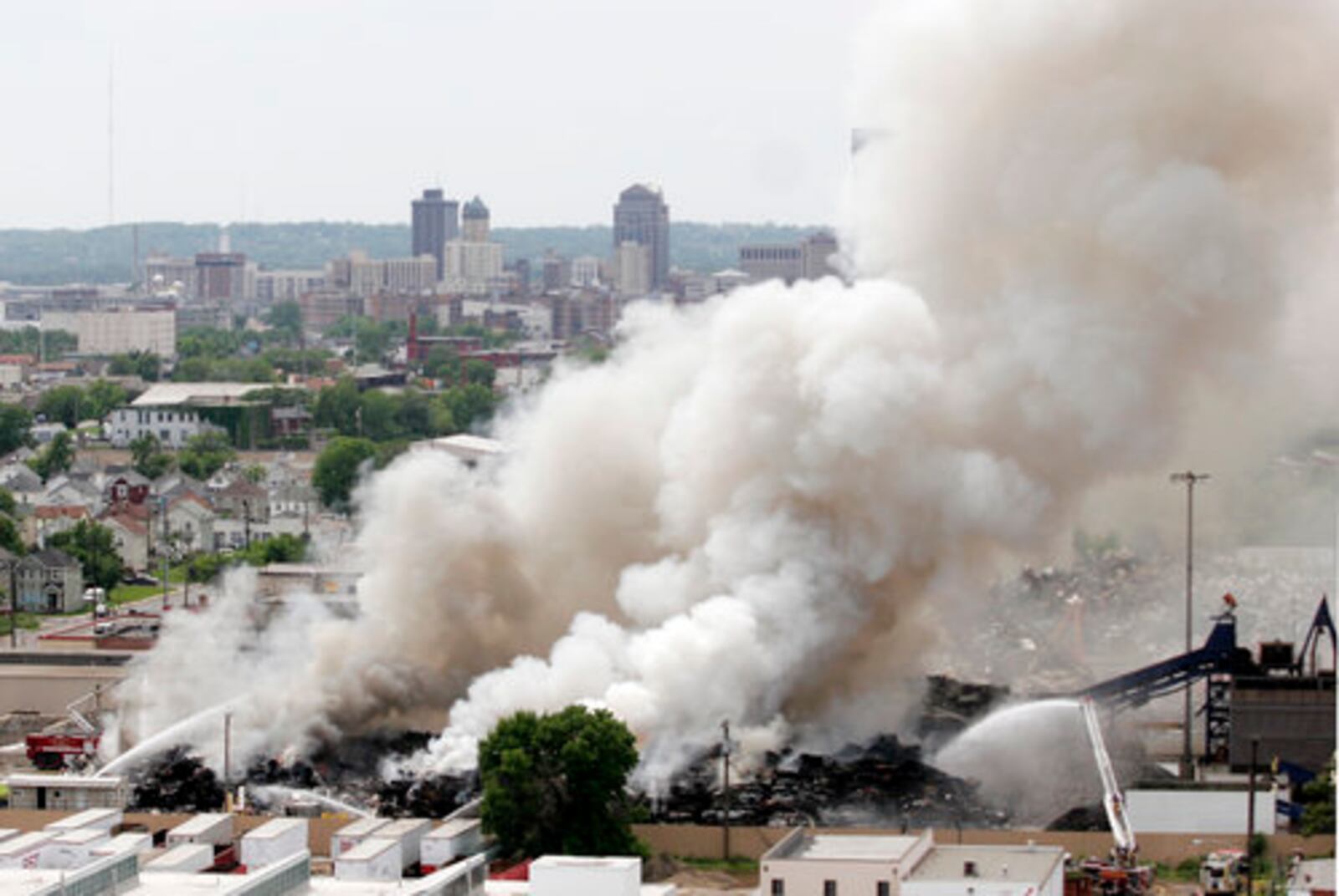 A pile of 3,000 scrap autos and appliances burns Thursday, May 20, at Franklin Iron and Metal, 2015 E. First St. in Dayton.