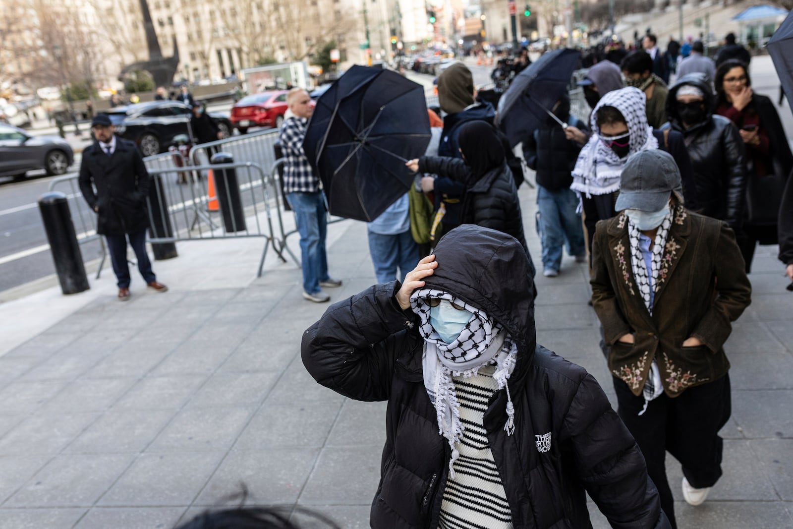 Students from Columbia University arrive at the Manhattan federal court prior to the deportation case of Mahmoud Khalil, Wednesday, March 12, 2025, in New York. (AP Photo/Stefan Jeremiah)