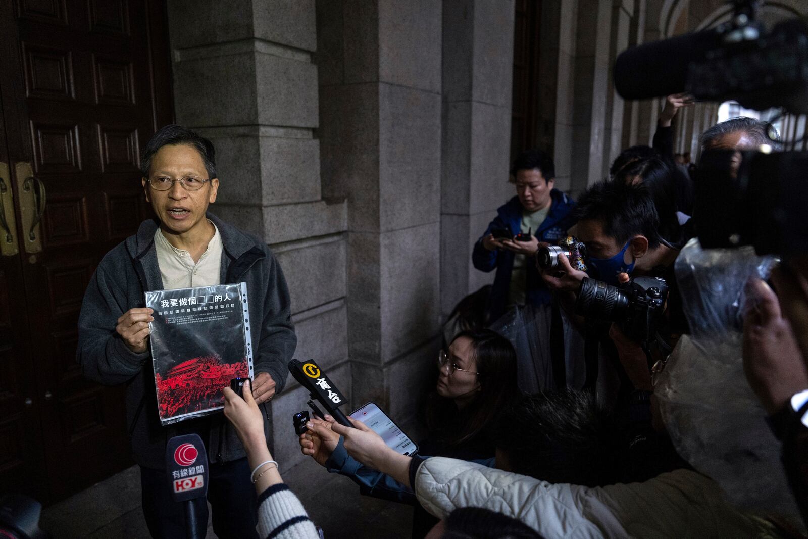 Tang Ngok-kwan, one of core members of the Hong Kong Alliance in Support of Patriotic Democratic Movements of China, speaks to the members of the media, at the Court of Final Appeal in Hong Kong, Thursday, March 6, 2025. (AP Photo/Chan Long Hei)