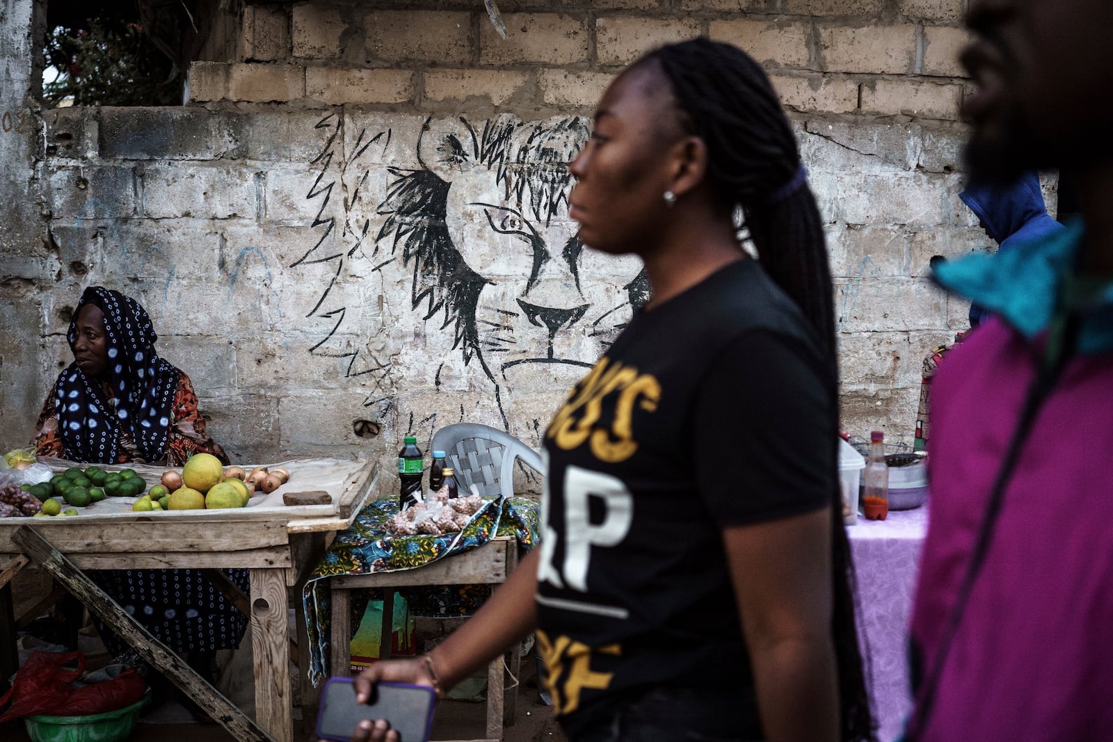 A lion is drawn on the wall of a market in Dakar, Senegal, on Friday, Jan. 17, 2025. (AP Photo/Annika Hammerschlag)