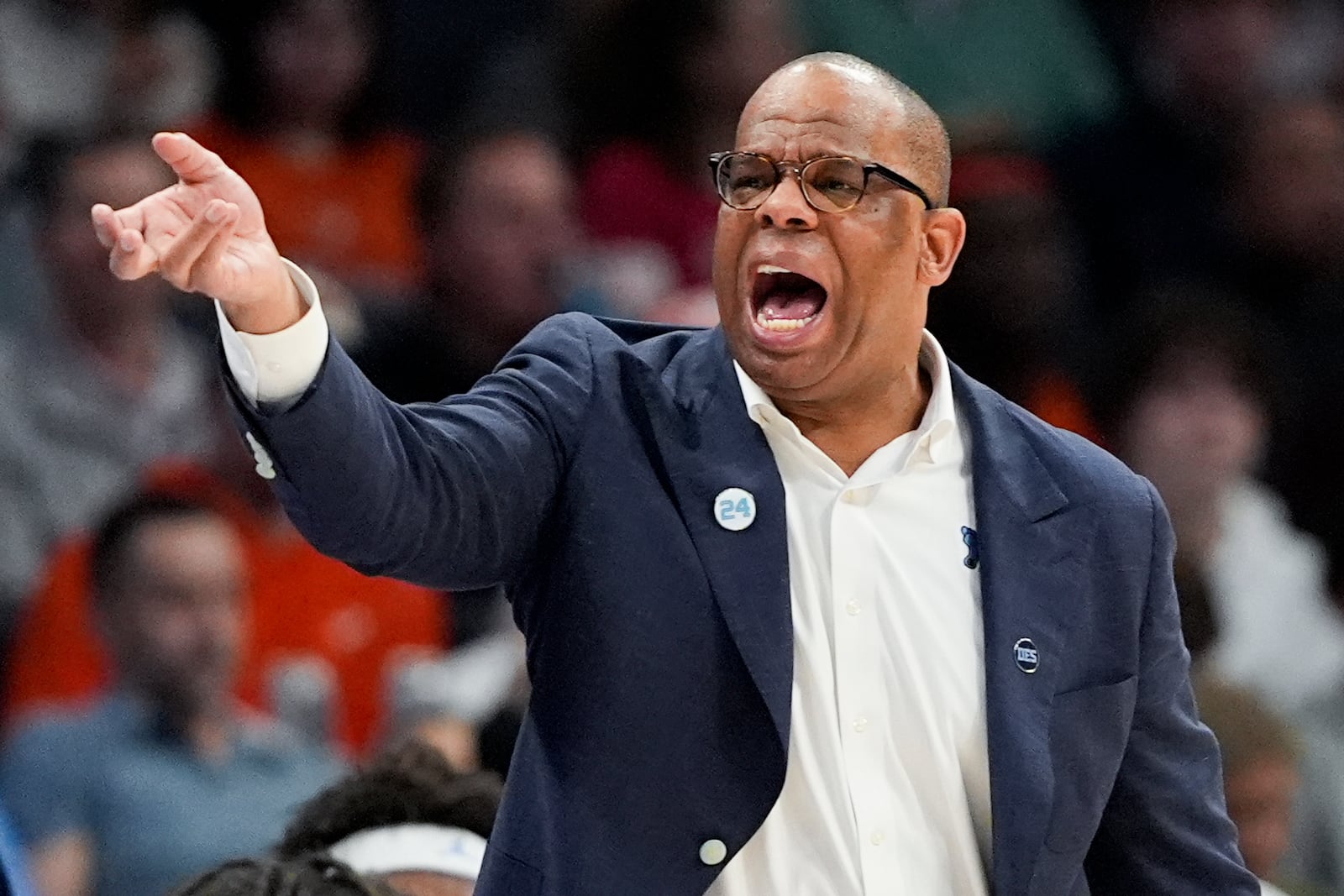 North Carolina head coach Hubert Davis yells during the first half of an NCAA college basketball game against Duke in the semifinals of the Atlantic Coast Conference tournament, Friday, March 14, 2025, in Charlotte, N.C. (AP Photo/Chris Carlson)