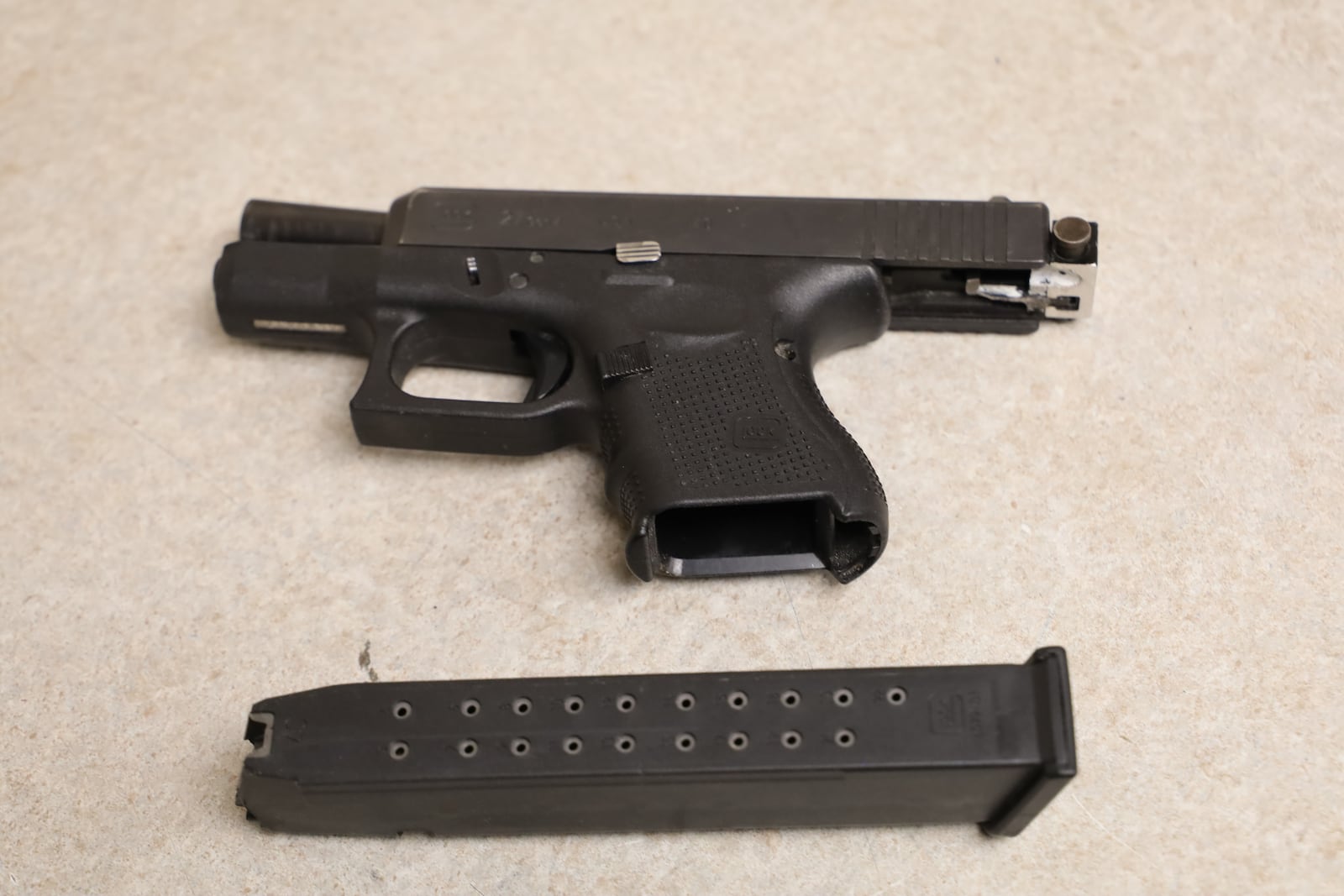 A Glock pistol that law enforcement task force officers say they found in the possession of Antone Jackson on July 13. Jackson was arrested in downtown Dayton after he allegedly cut off his ankle monitor. Authorities say the Glock was outfitted with a "switch" that converts the semiautomatic pistol into a fully automatic weapon. CONTRIBUTED