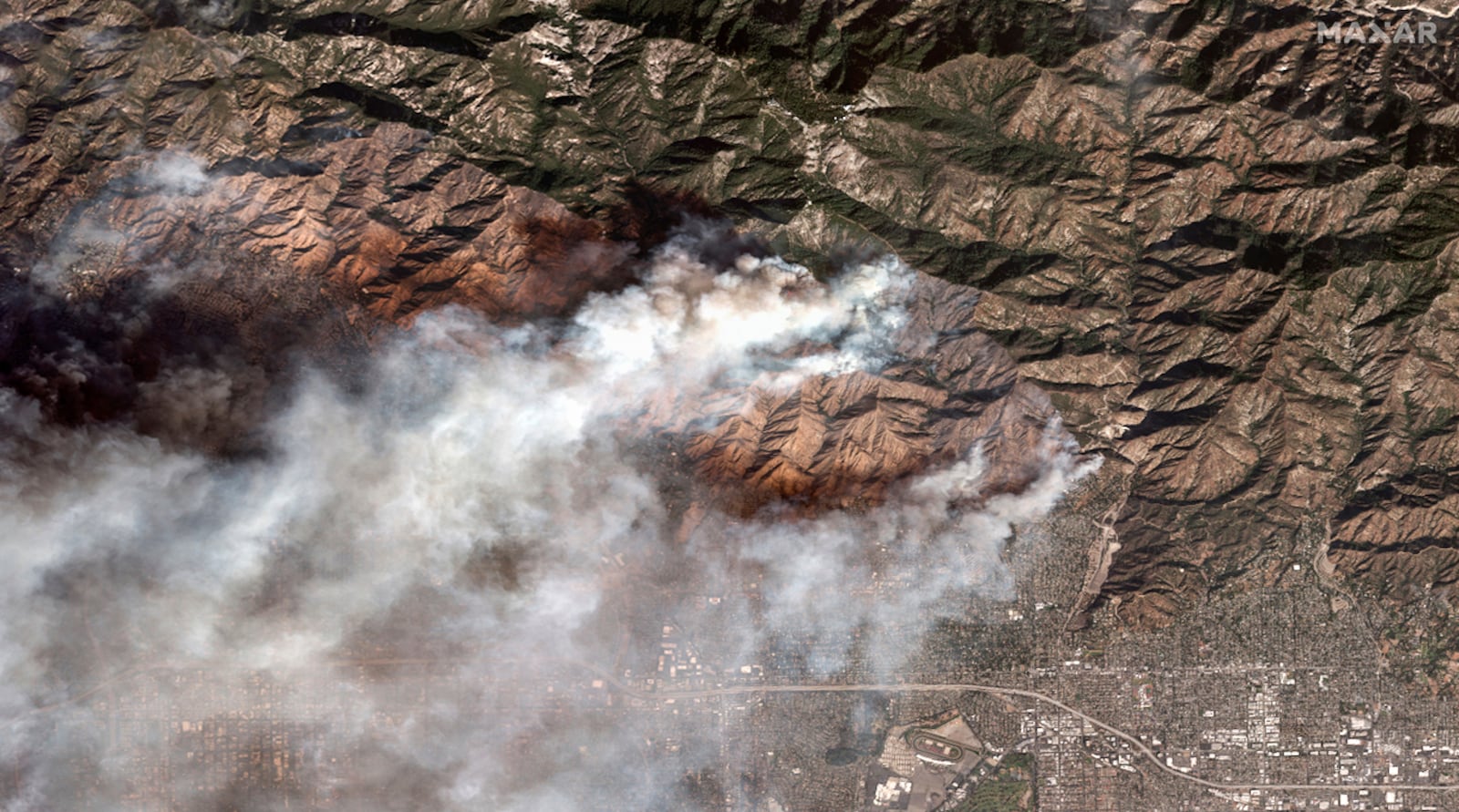 This satellite image provided by Maxar Technologies shows the Eaton Fire burning in and near Altadena, Calif., Wednesday, Jan. 8, 2025. (Maxar Technologies via AP)