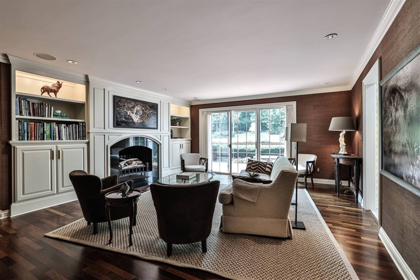 The family room has a fireplace flanked by built-in bookcases and cabinetry. 