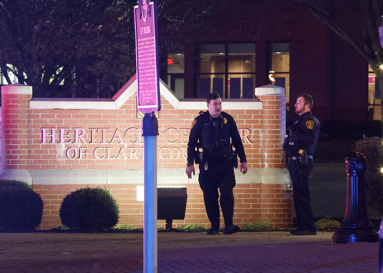 Springfield police investigate the scene of a shooting in the parking lot of the Clark County Heritage Center Friday, Nov. 25, 2022 following the Holiday in the City kickoff. BILL LACKEY/STAFF