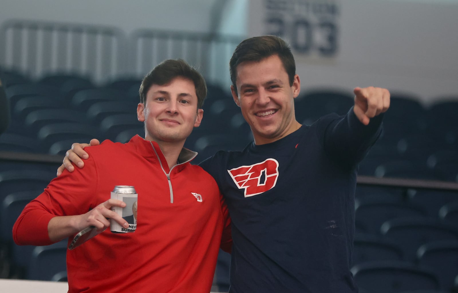 Dayton fans pose for a photo before a game against George Washington on Saturday, Jan. 4, 2025, at the Charles E. Smith Center in Washington, D.C. David Jablonski/Staff