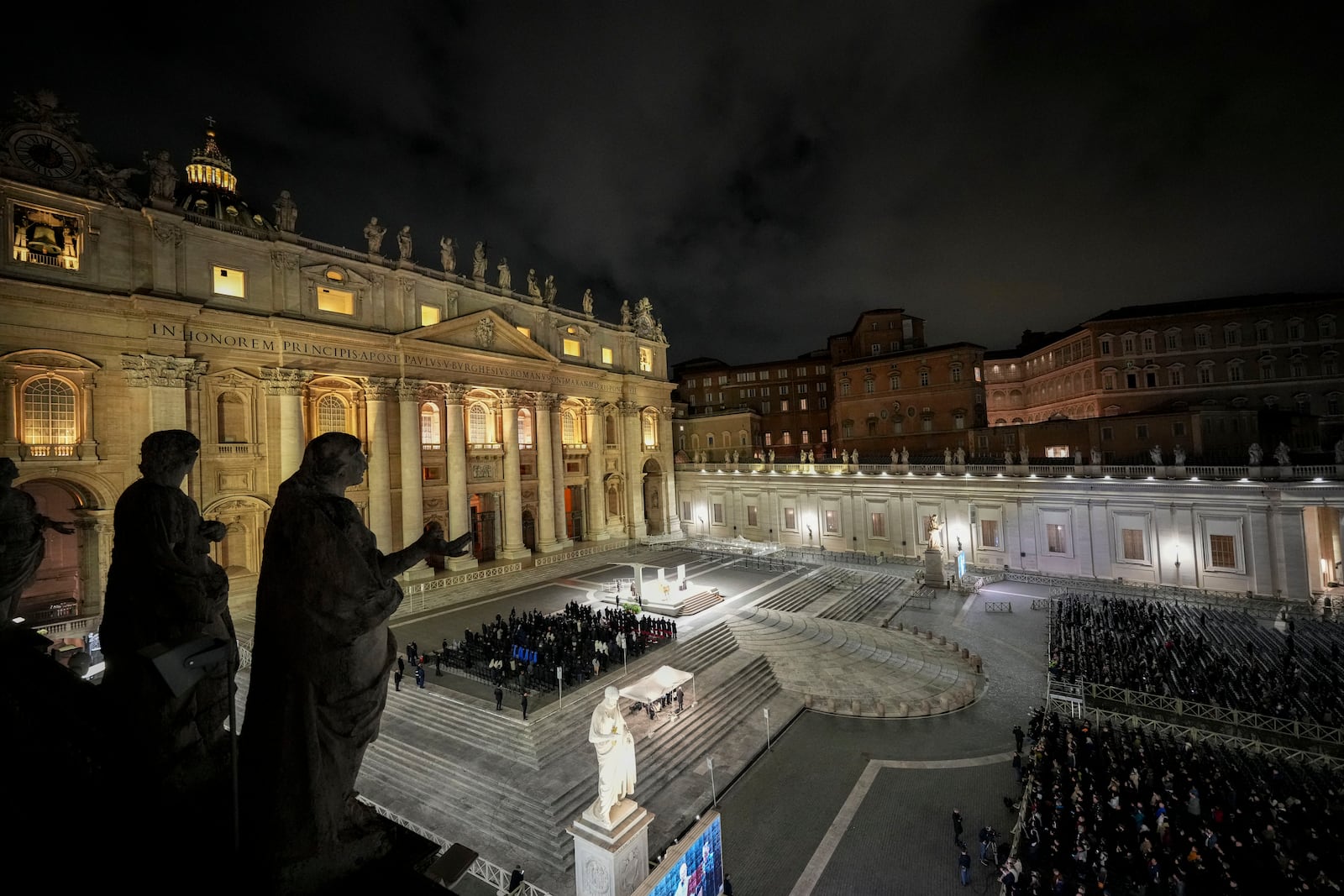 People attend a rosary prayer with Cardinal Victor Manuel Fernandez held for the health of Pope Francis in St Peter's Square at the Vatican, Friday, Feb. 28, 2025. (AP Photo/Andrew Medichini)