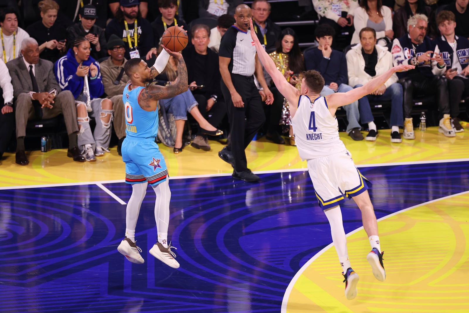 Milwaukee Bucks guard Damian Lillard shoots over Los Angeles Lakers forward Dalton Knecht during the NBA All-Star basketball game Sunday, Feb. 16, 2025, in San Francisco. (AP Photo/Jed Jacobsohn)