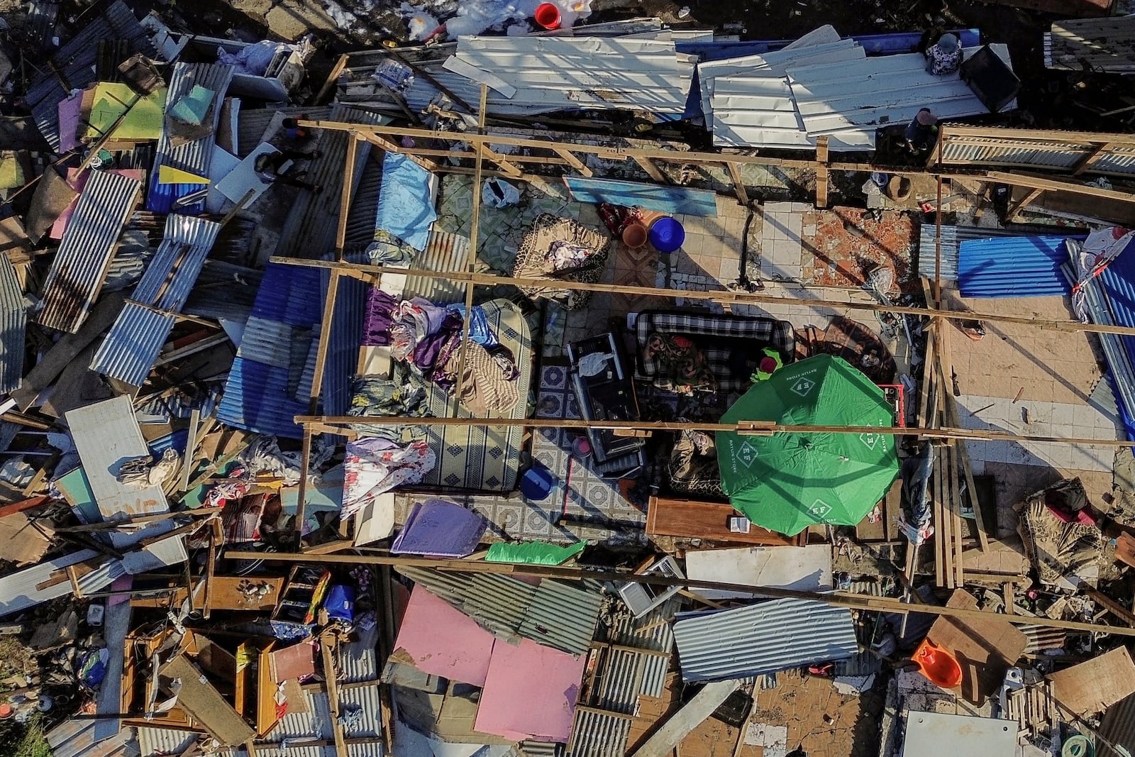 Drone view of destroyed dwellings in Mirereni, Mayotte, Friday, Dec. 20, 2024. (AP Photo/Adrienne Surprenant)