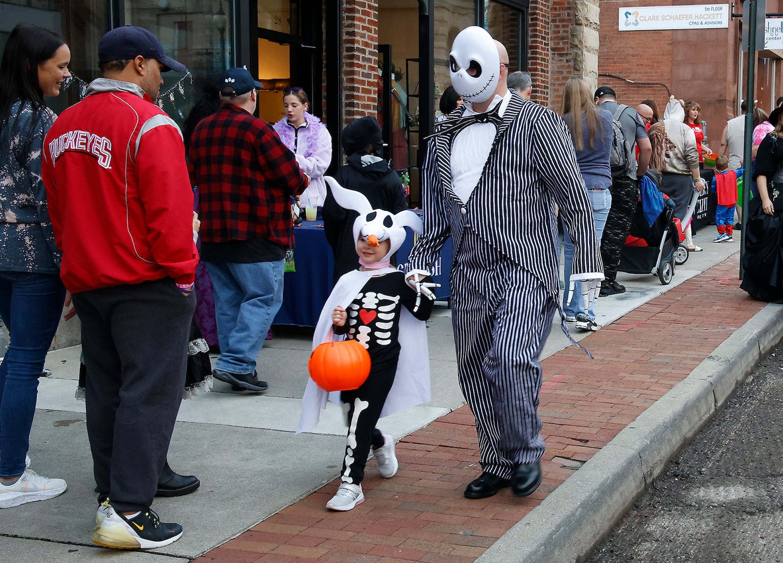 Hundreds of creepy and cute characters filled the sidewalks and streets in downtown Springfield for the sixth annual Downtown Springfield Trick or Treat Friday, Oct. 27, 2023. Downtown merchants, community organizations and nonprofits passed out candy, Halloween characters roamed the streets and danced to music in the streets and magicians were showing off some tricks. BILL LACKEY/STAFF